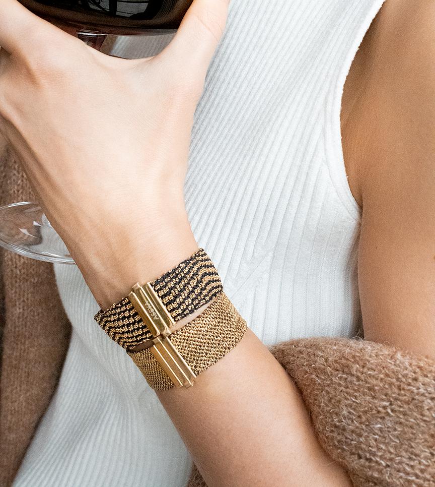 Exquisitely made, this intricate cuff is weaved on an antique style loom into a unique black & gold design. It is made with diamond cut 18ct Gold Vermeil chain  and black Silk. You can wear it on its own as a fun & luxurious statement piece to