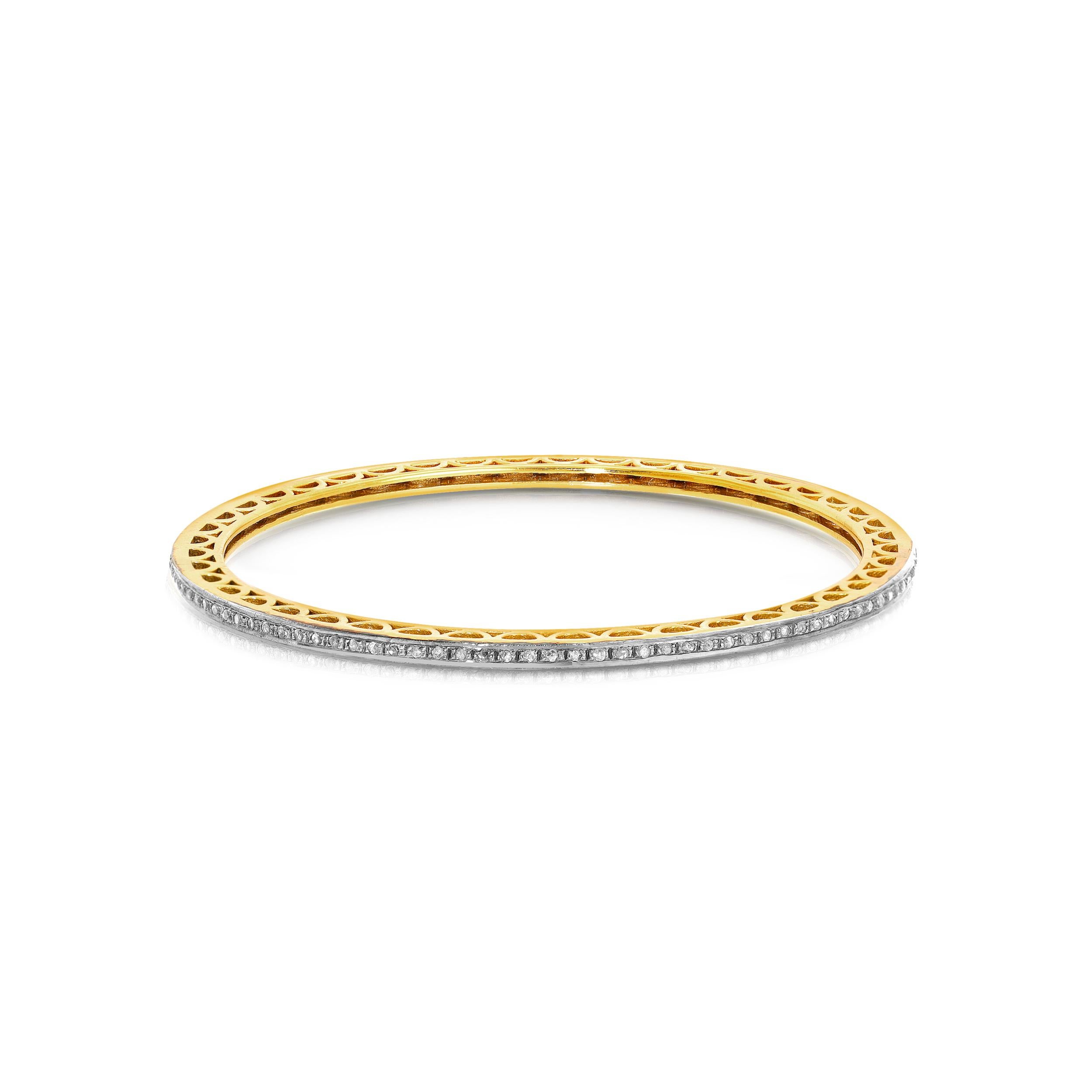 A fully set Diamond bangle featuring .80 Carats of White Diamonds set in Blackened Silver on contemporary bangle of 18 Karat Gold overlay Silver... The ultimate in chic, stylish glamour alone or a perfect contrasting accompaniment to stacks of