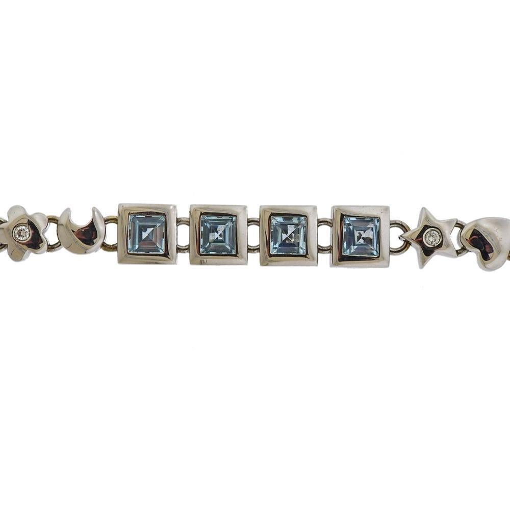 18k white gold Italian-made bracelet with blue topaz gemstones and approx. 0.15ctw in diamonds. Bracelet is 7 1/8