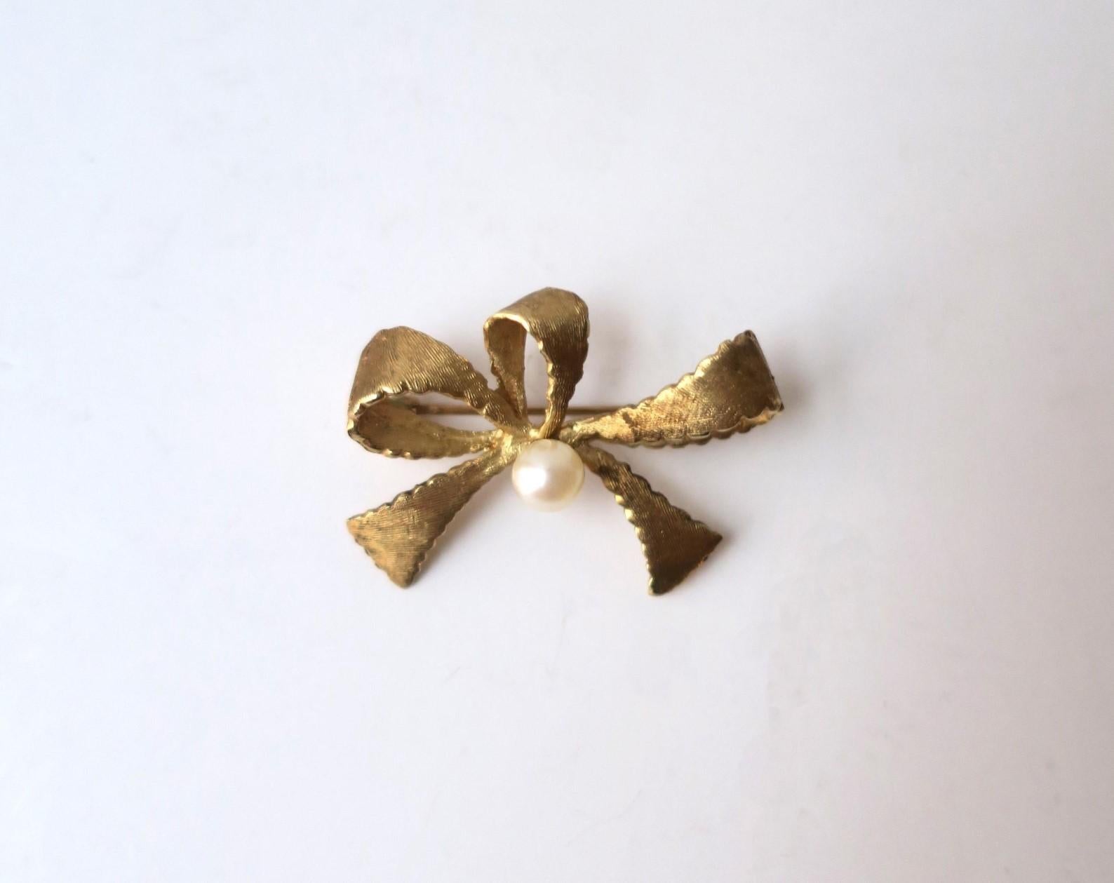 Round Cut Gold Bow Brooch with Cultured Pearl For Sale