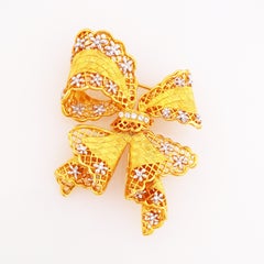 Gold Bow Figural Brooch With Openwork Lattice and Floral Motif By Nolan Miller