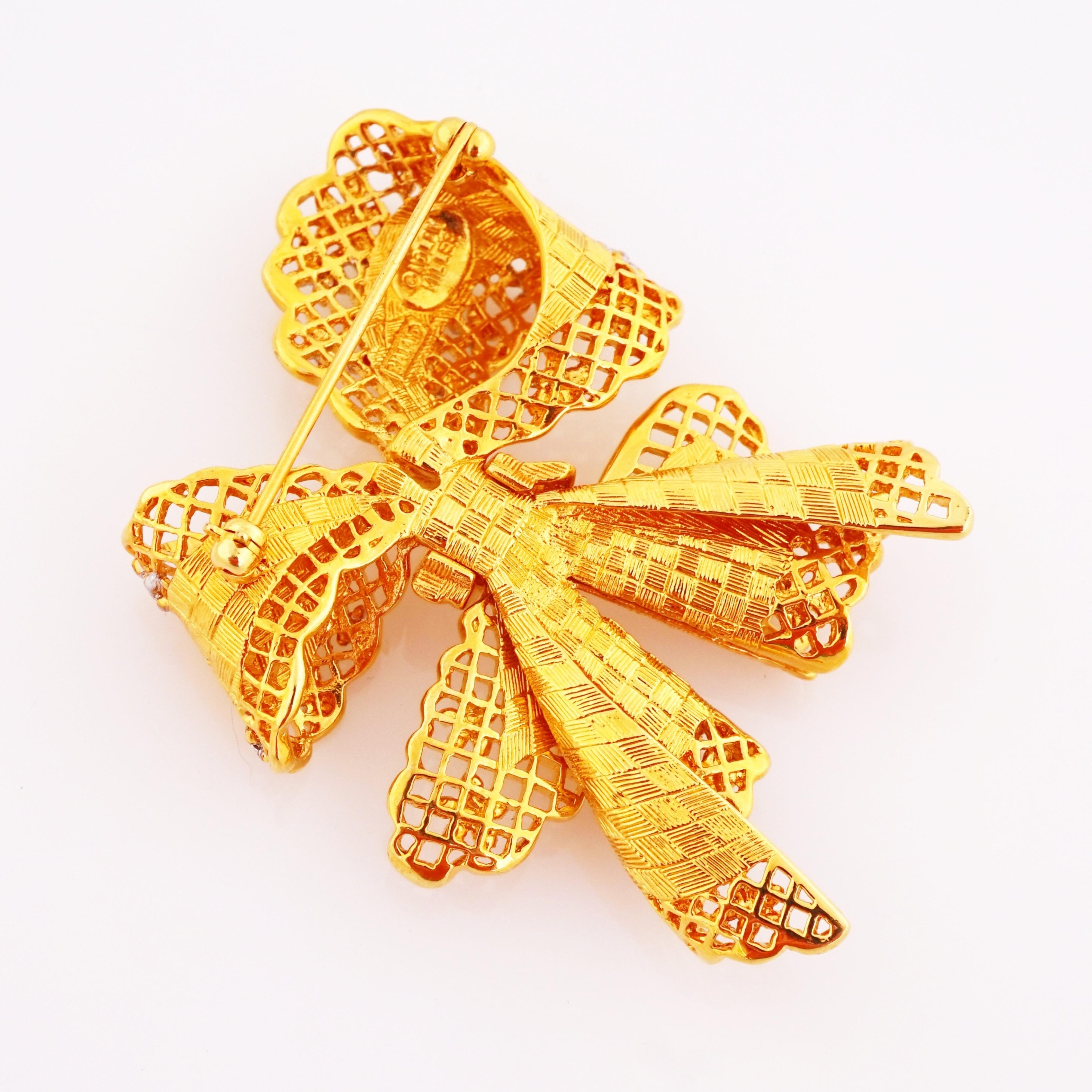 Modern Gold Bow Figural Brooch With Openwork Lattice and Floral Motif By Nolan Miller