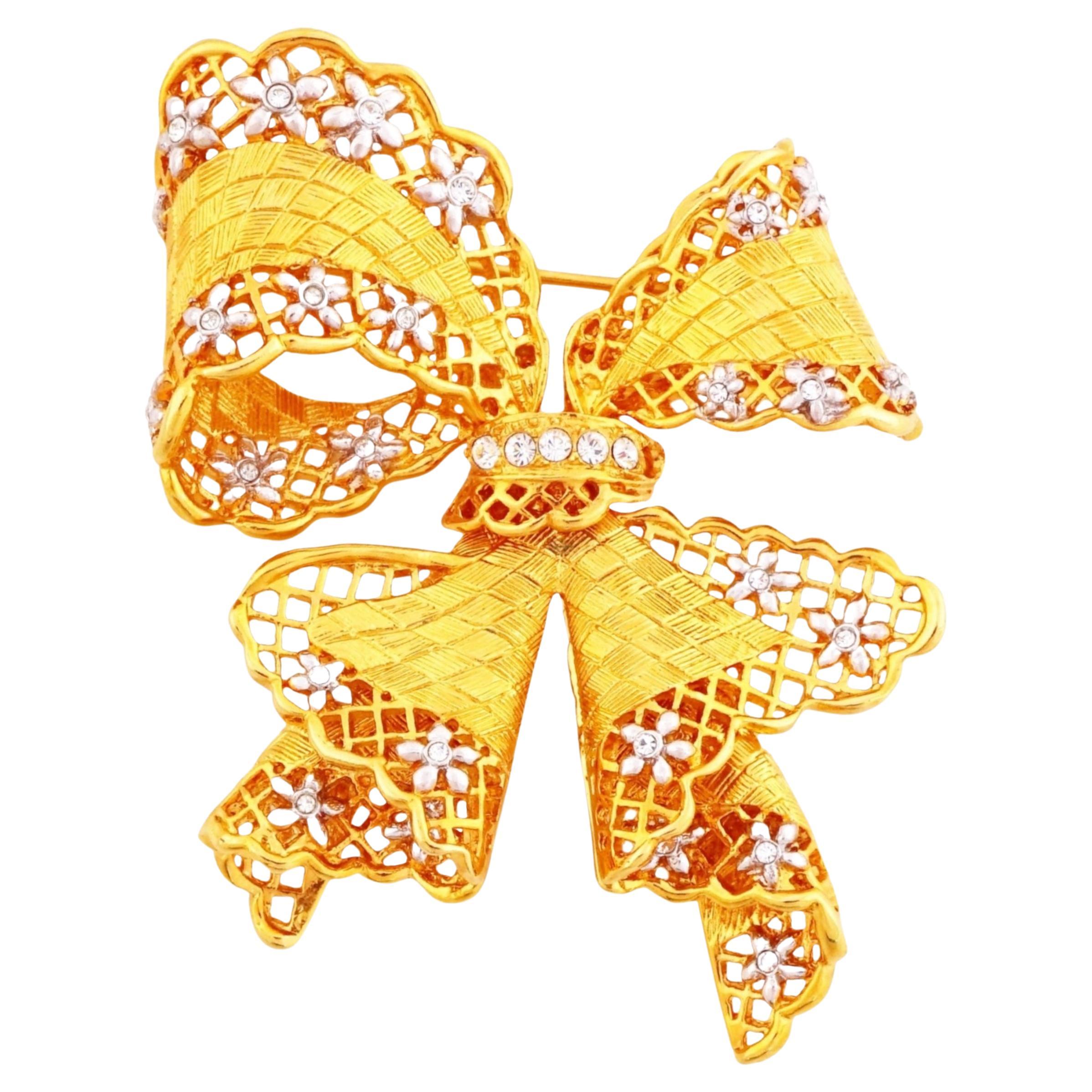 Gold Bow Figural Brooch With Openwork Lattice and Floral Motif By Nolan Miller