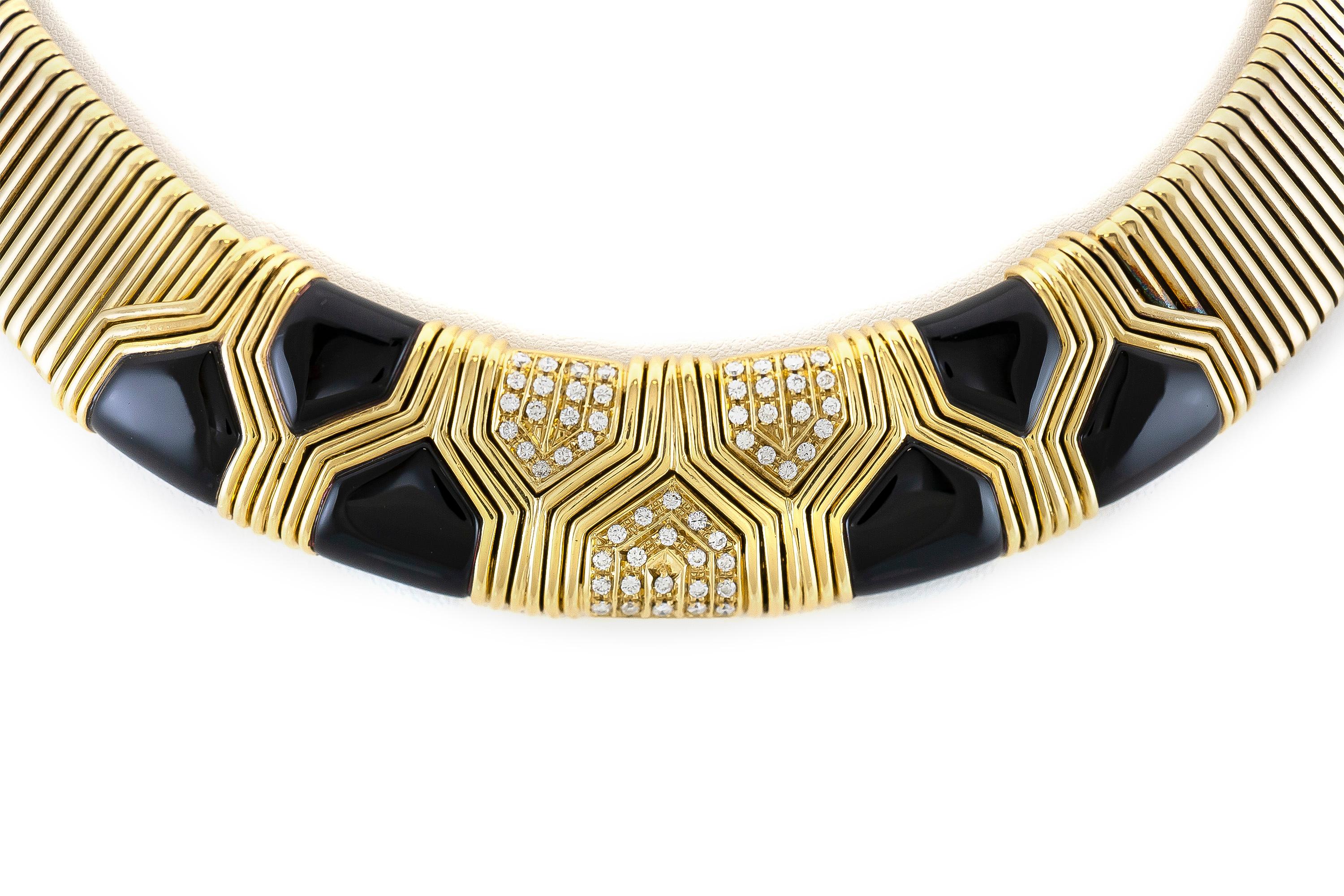 Set of a necklace and a bracelet finely crafted in 18 karat yellow gold; necklace 118.4 DWT and bracelet 64.5 DWT and black onyx. Both items with diamonds weighing of 1.80 karat. 
Circa 1980.