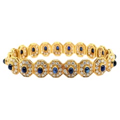 Armband aus 18 Karat Gelbgold mit blauenen Saphiren und Diamanten