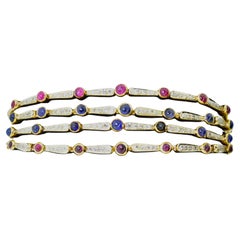 Gold Bracelet with Diamonds, Sapphires and Rubies, circa 1940