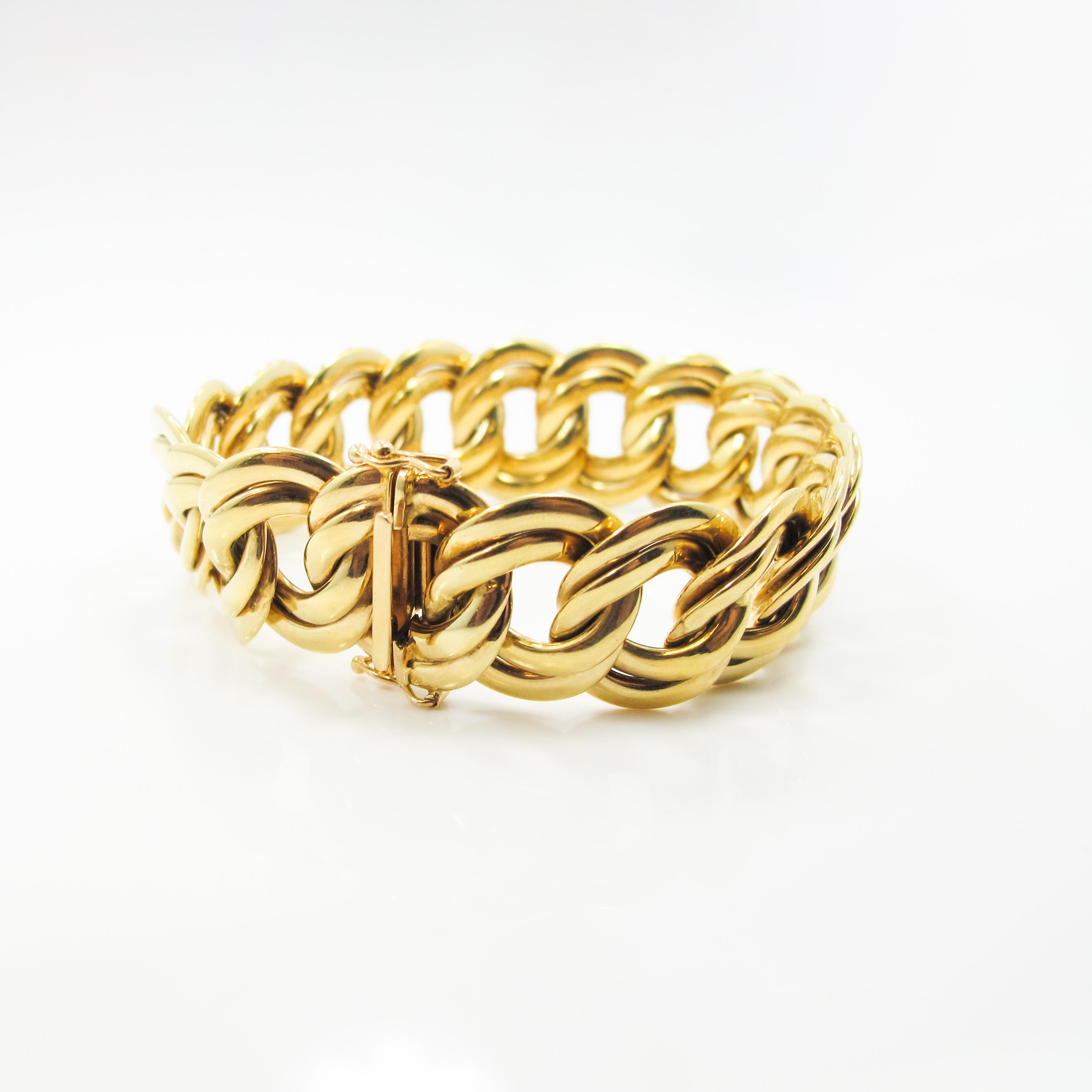 This bracelet features double ringlet loops that are connected in a woven link fashion. The bracelet features a uniform box clasp with double figure eight safeties. The bracelet is used/refinished, 14k yellow gold, 35.81g. Size 7.5.