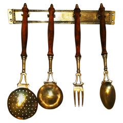 Gold Brass and Wood Kitchen Utensils with from a Hanging Bar, Early 20th Century
