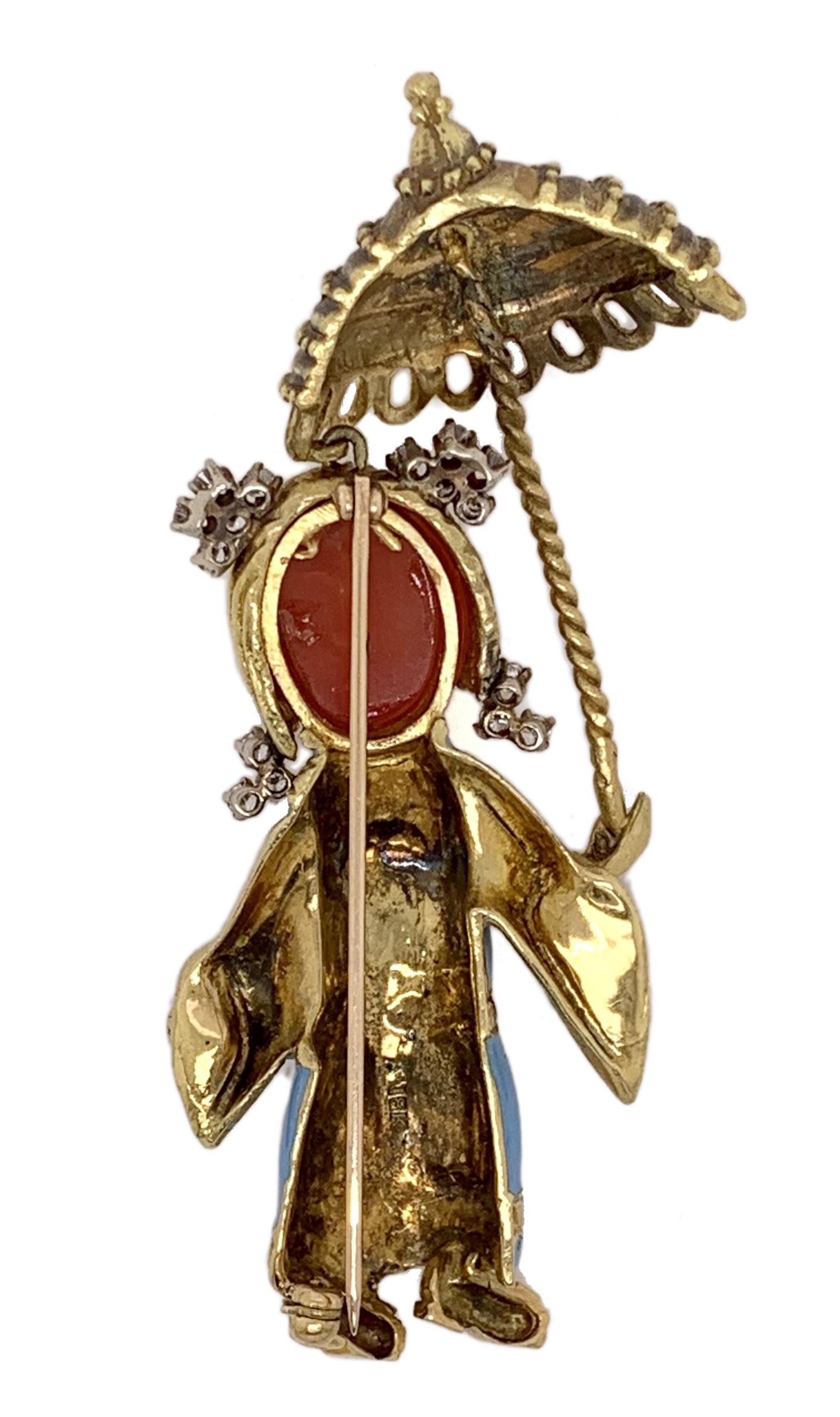 An American mid-20th Century 18 karat yellow gold brooch with enamel, diamonds and coral, attributed to Donald Claflin for Tiffany & Co. The brooch has a cabochon-cut coral face with black enamel eyes, turquoise enamel dress, and 16 round brilliant