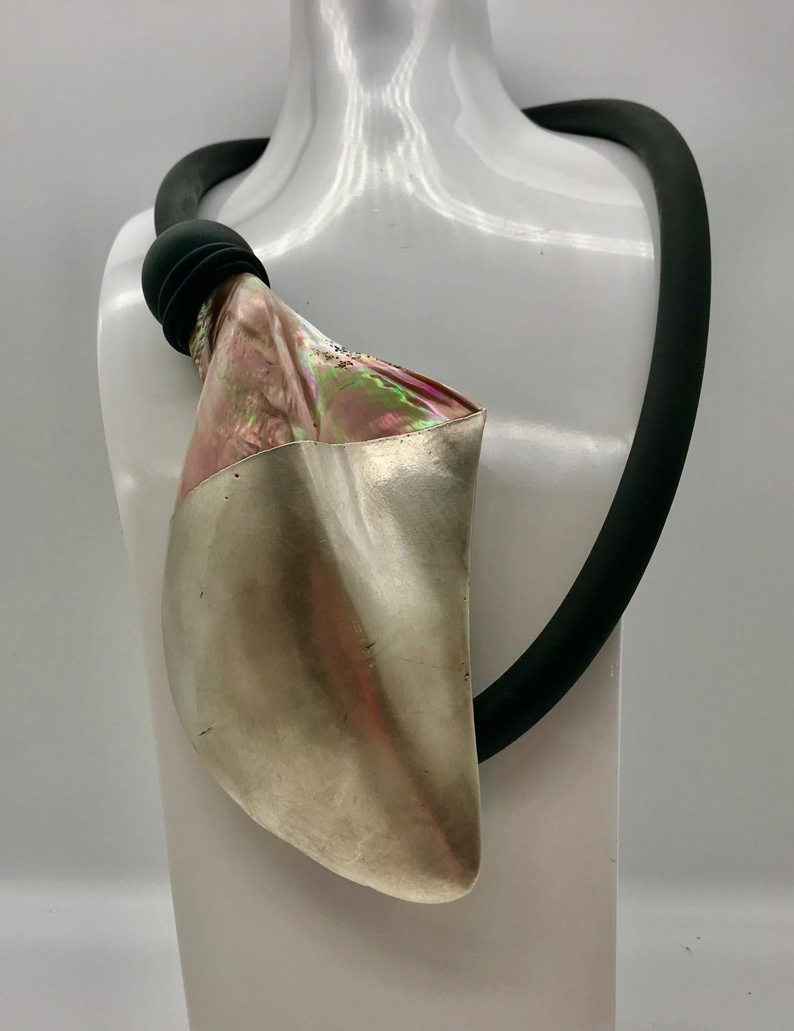 Gold/brown iridescent Nacre , Pteria Penguin Silvered Pendant and matching Clip Earrings. This is an unusual piece which I have had  silvered in Rome way back in 2001. In those days jewelry without silver or gold or precious stone was unusual.