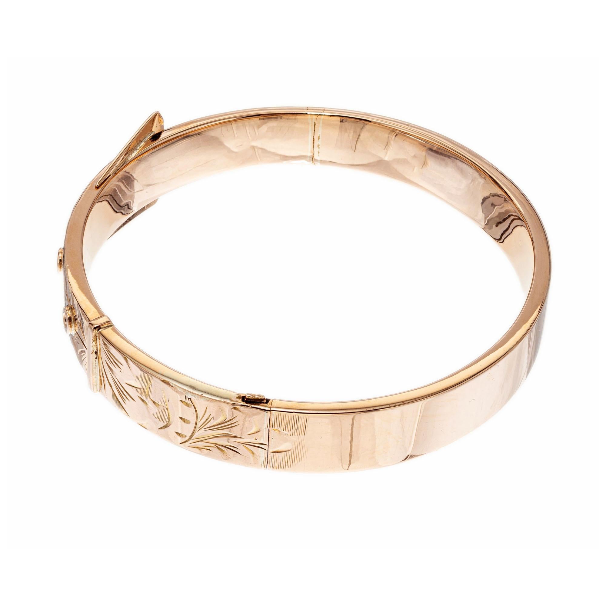 Handmade buckle style hinged 14k gold bangle bracelet. Fits a standard 7 ½ to 8 inch wrist. Circa 1930’s. On Peter's now famous rose gold scale of 1 to 10 with 10 as the deepest rose this scores a 2.5. Hand engraved detail across top half.  

14k