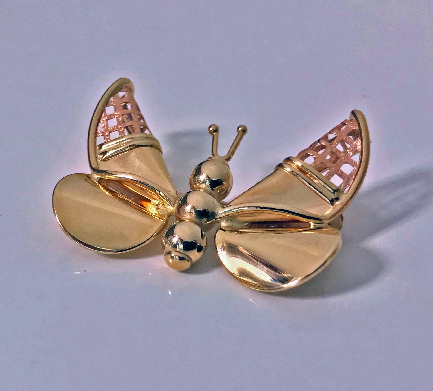 14K two colour Gold Butterfly Brooch. The antennae, abdomen and wings of polished yellow gold, the turned forewings of pierced textured rose colour gold. Stamped on reverse 14K Italy. Measures: approximately 1.50 x 1.0 inches. Item Weight: 6.02