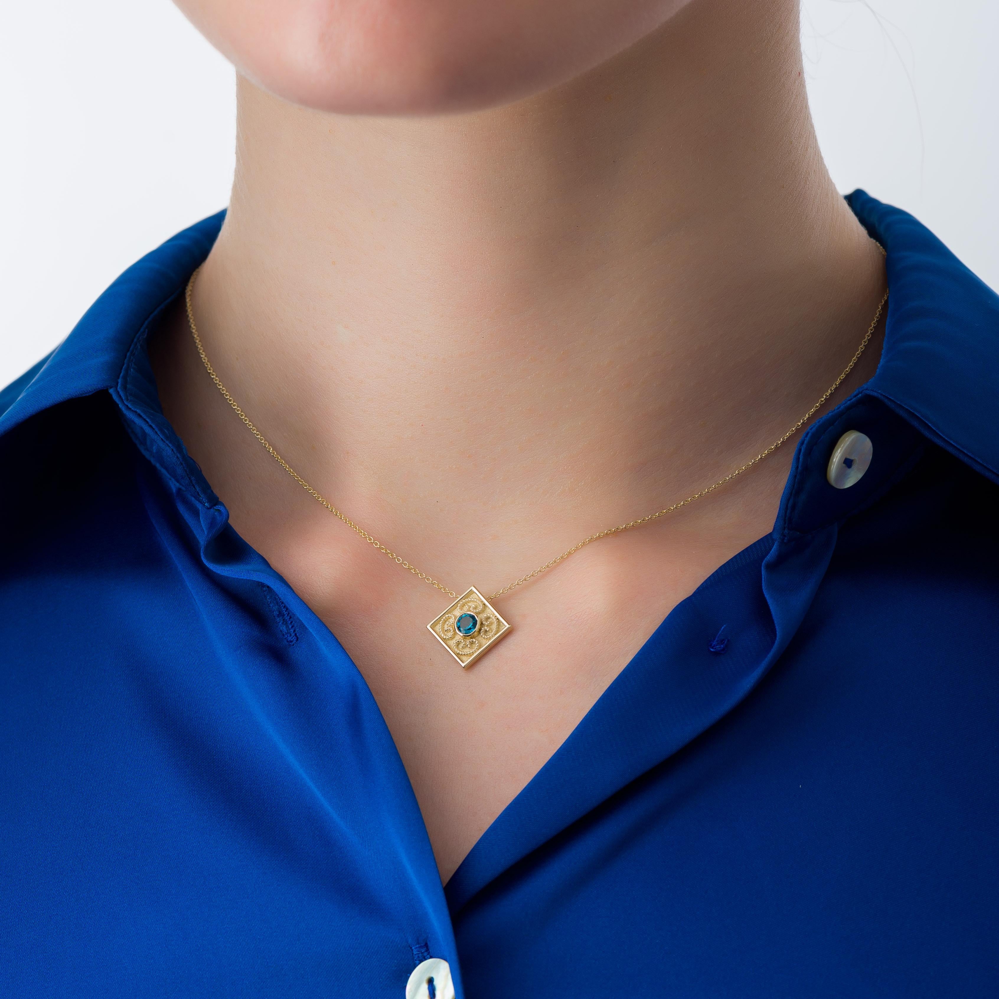 Admire the captivating beauty of a square gold pendant, embellished with intricate omega rope gold details and crowned by a resplendent round London topaz at its center—a harmonious symphony of design and color that radiates timeless charm.

100%