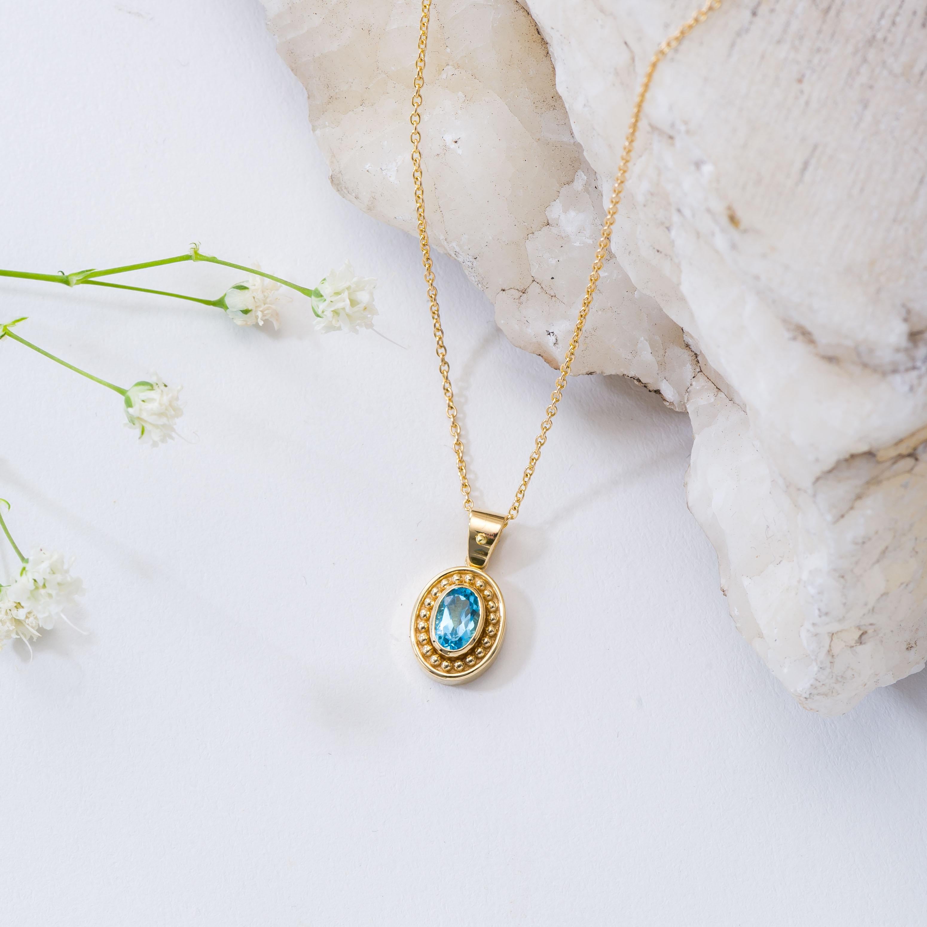 Oval Cut Gold Byzantine Pendant with Swiss Blue Topaz For Sale