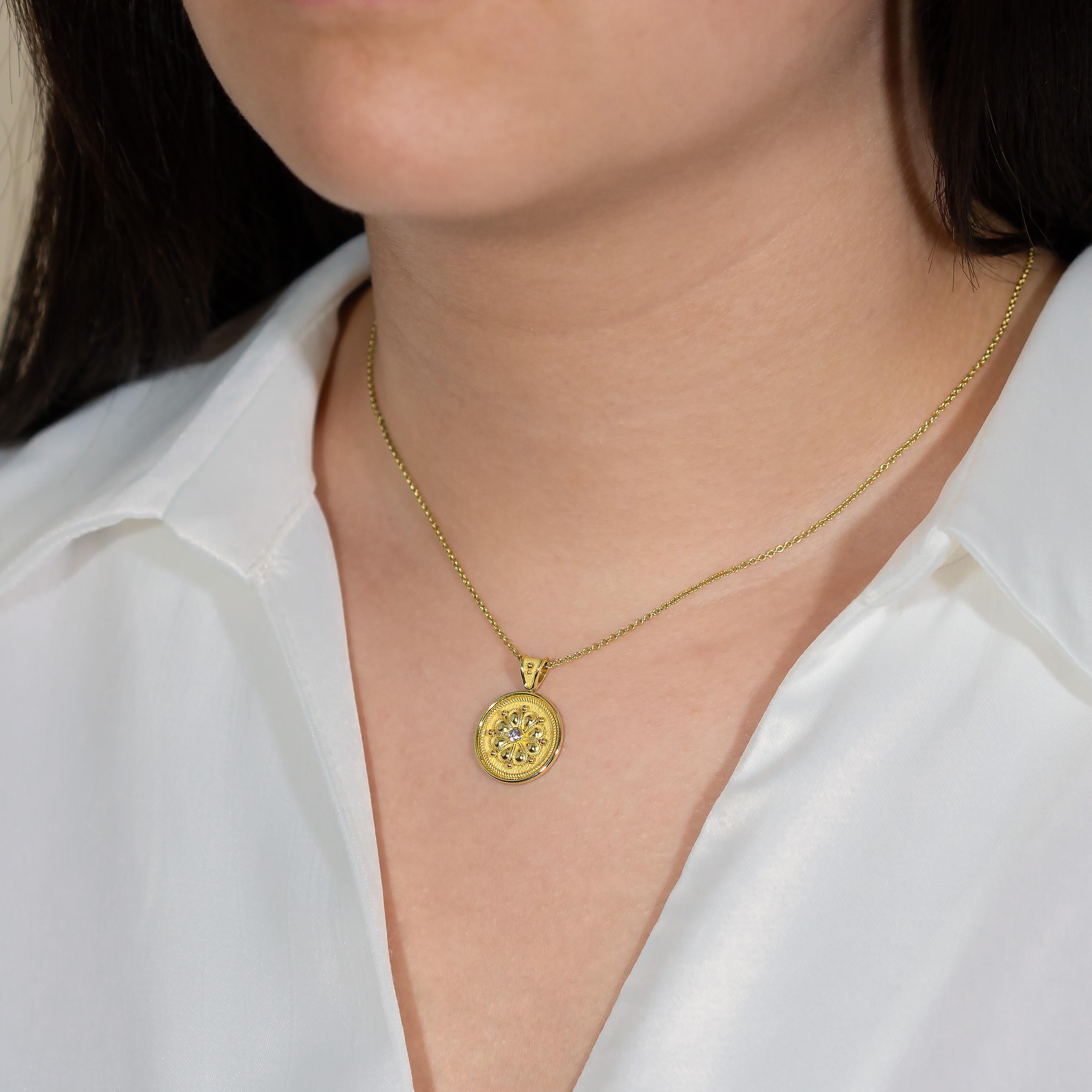 Embrace the delicate charm of our round gold pendant, where a gleaming gold daisy takes center stage, accentuated by a brilliant gem—a symbol of elegance and natural beauty.

100% handmade in our workshop.

Metal: 18K Gold
Gemstones: Diamond  weight