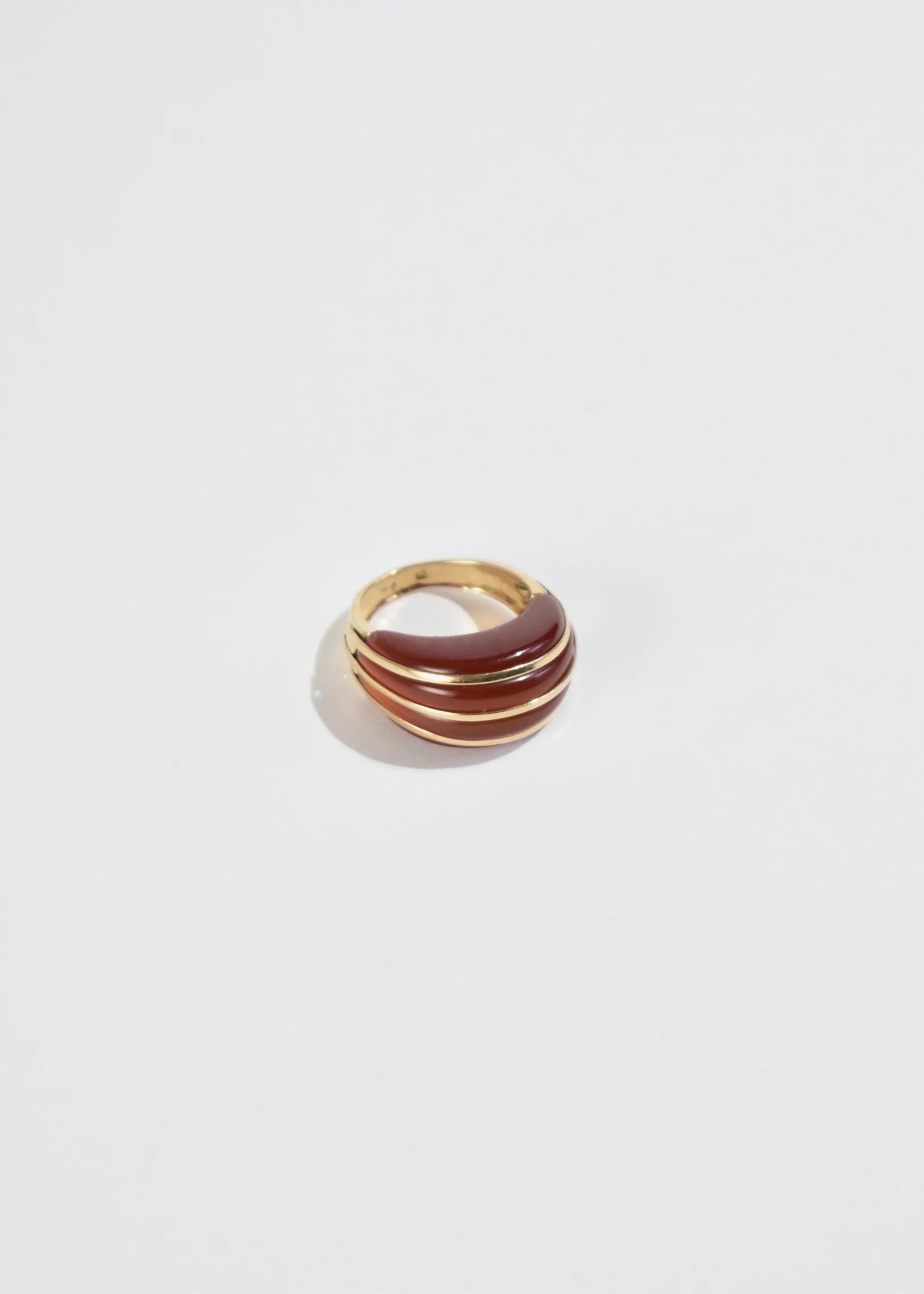 Stunning vintage carved carnelian statement ring with gold detail. Stamped 14k.

Material: 14k gold, carnelian.

We recommend storing in a dry place and periodic polishing with a cloth.