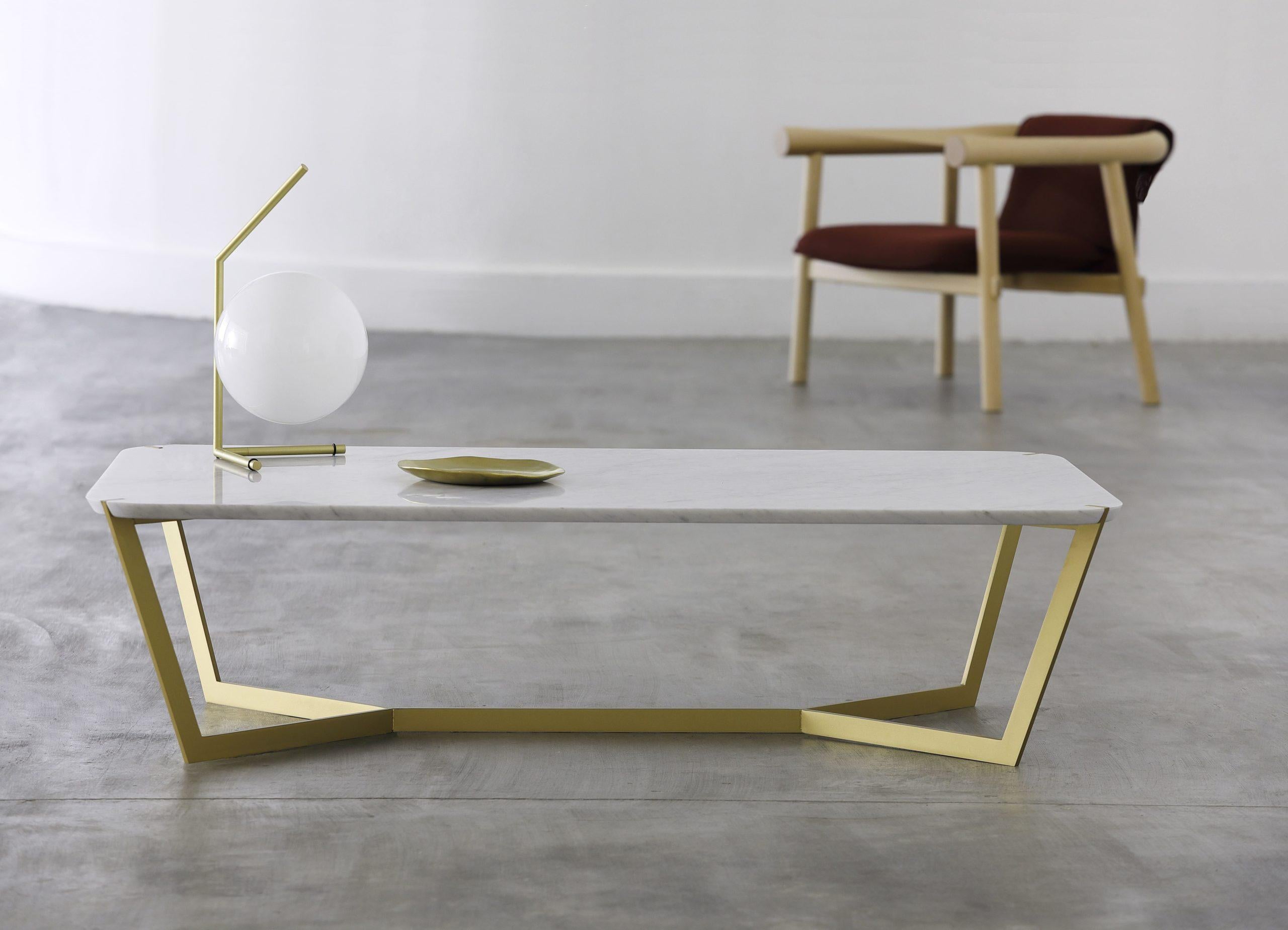 Gold carrara marble star coffee table by Olivier Gagnère
Materials: Carrara marble or black Marquina marble top. Gold lacquered metal base.
Technique: Lacquered metal, polished marble. 
Dimensions: D 70 x W 125 x H35cm
Also available in nero