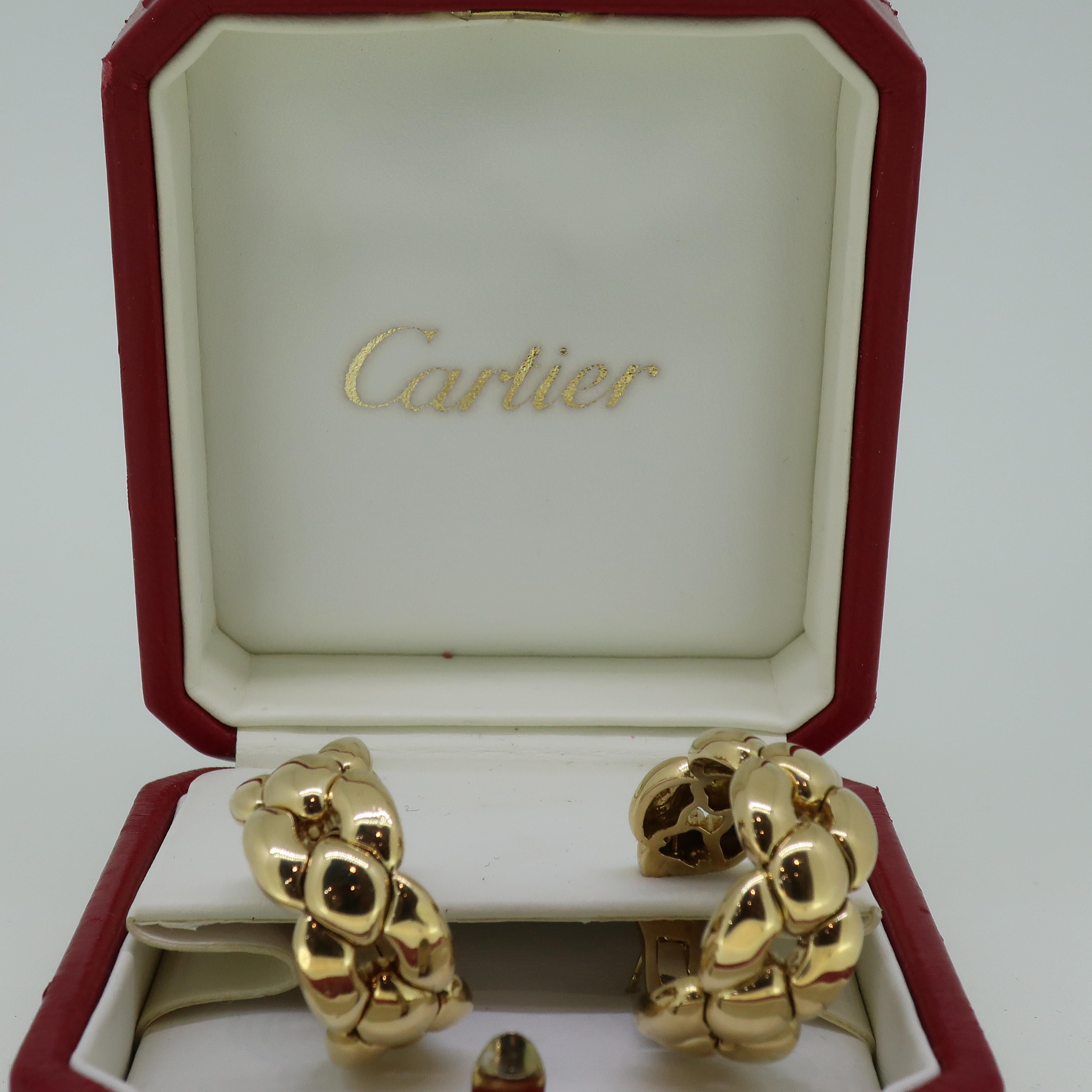 Gold Cartier Chain Link Large Hoop Earrings 18 Karat Yellow Gold 1992 

A fabulous pair of 18ct yellow gold earrings by Cartier. These have post and omega fittings in yellow gold. The hoops are formed in the style of a chain. These earrings are very