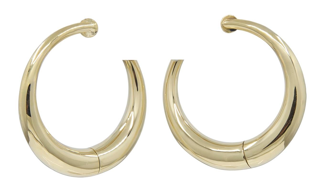 Classic graduated hoop earrings.  Made, signed and numbered by CARTIER.  18K yellow gold.  1 1/3