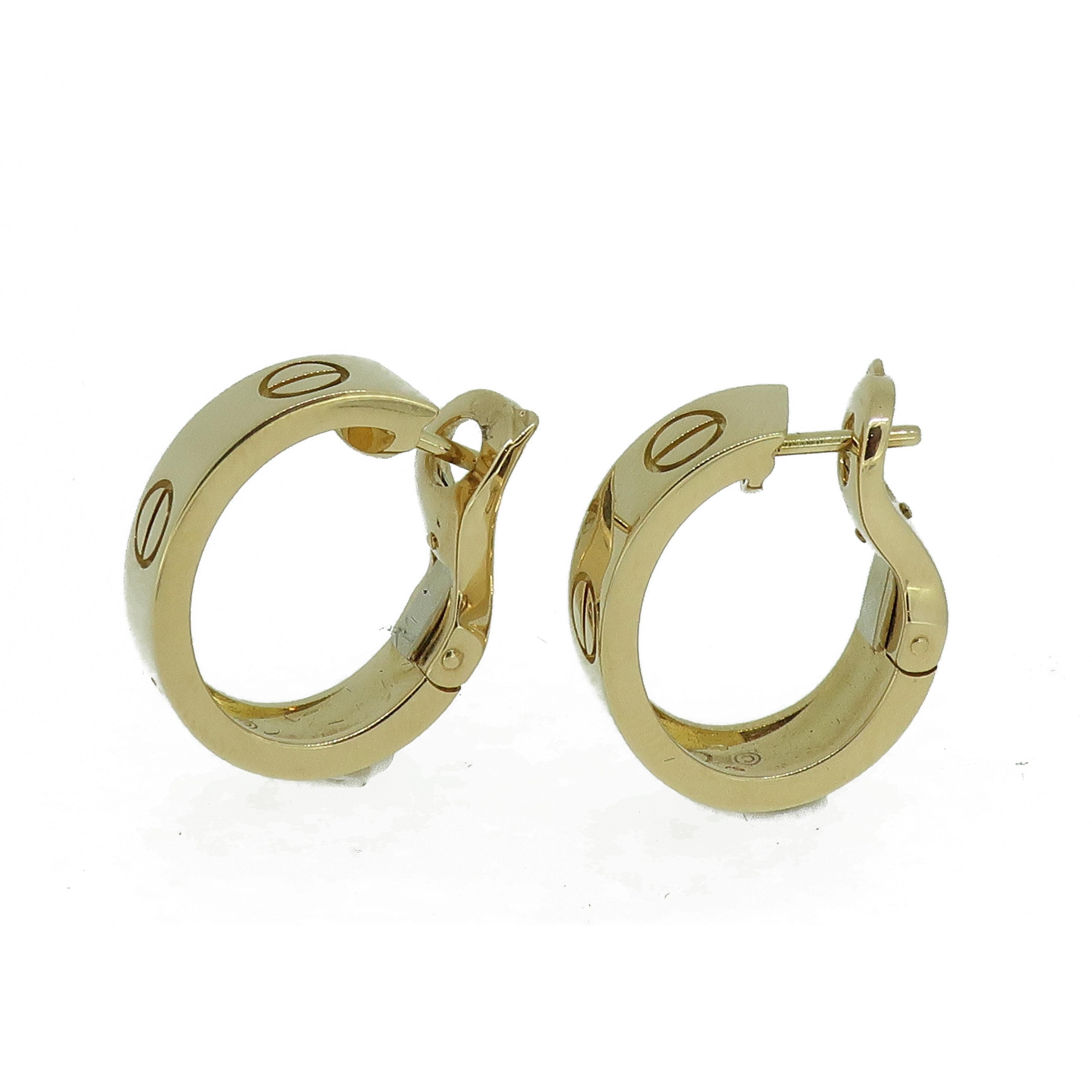 Gold Cartier 'Love' Hoop Earrings 18 Karat Yellow

Classic and stylish ]Cartier 'Love' earrings. 18ct yellow gold. 5.5mm wide. 
Iconic design featuring the screw design.
Signed Cartier 750
Total weight - 12g
Supplied in the original box but missing