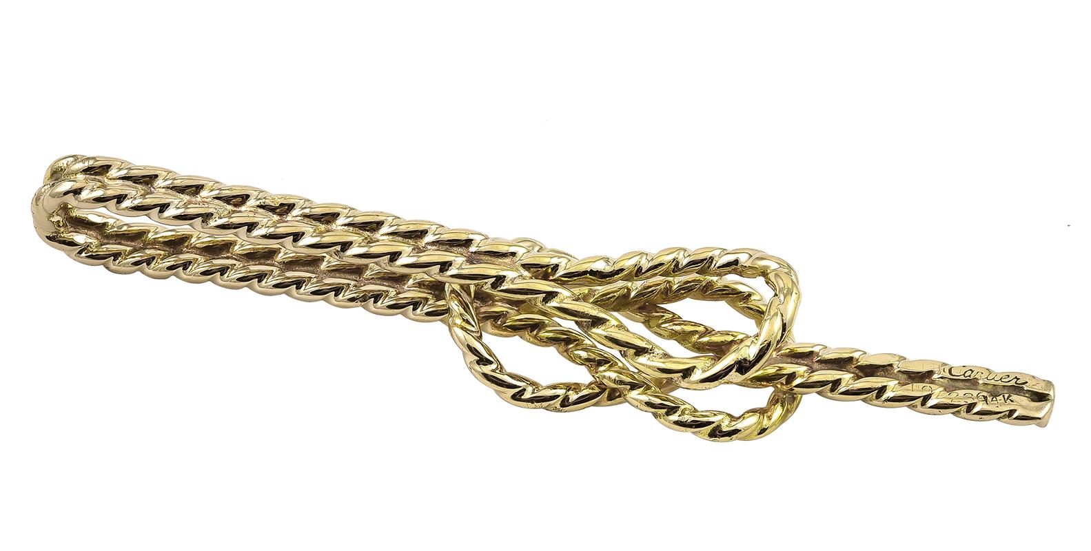 Nautical tie clip, in a rope pattern with a knot.  Made and signed by CARTIER.  Heavy gauge 14K yellow gold.  2 1/2