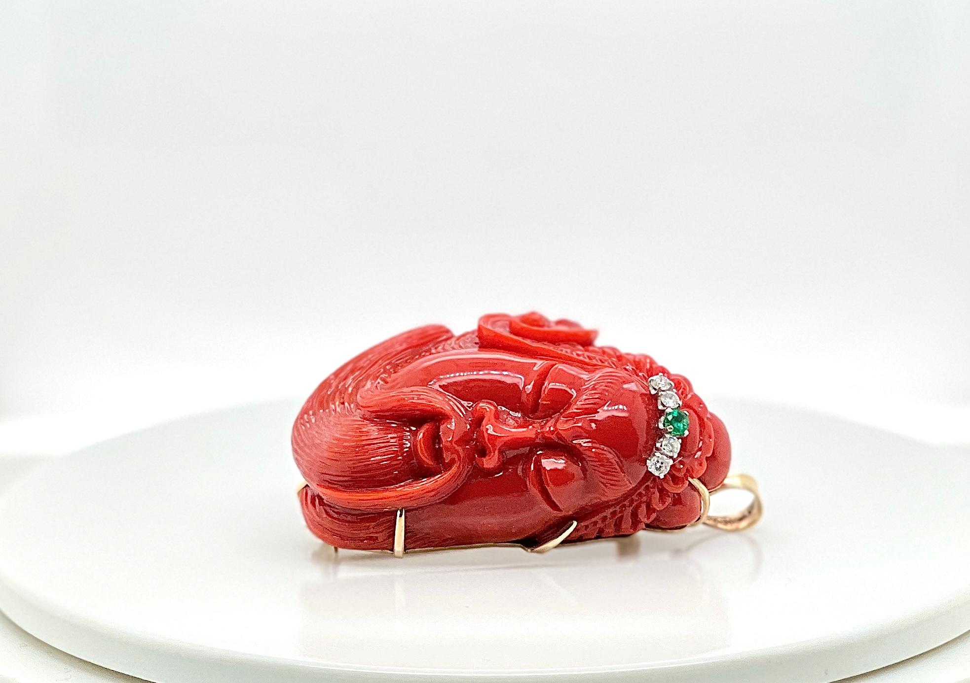 Gold carved face oxblood coral diamond and emerald brooch

Details:
Gold, coral, emerald, and diamonds, 85.07 grams, length 6.5 cm or 2.56 inches. 

In excellent condition 