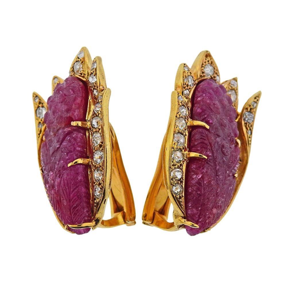 Pair of impressive 18k yellow gold earrings , set with two 28.0 x 11.4mm carved rubies, surrounded with old mine and rose cut diamonds - approx. 1.25ctw (one stone is missing) . Earrings measure 34mm x 20mm.  Tested 18k. Weigh 25.9 grams.