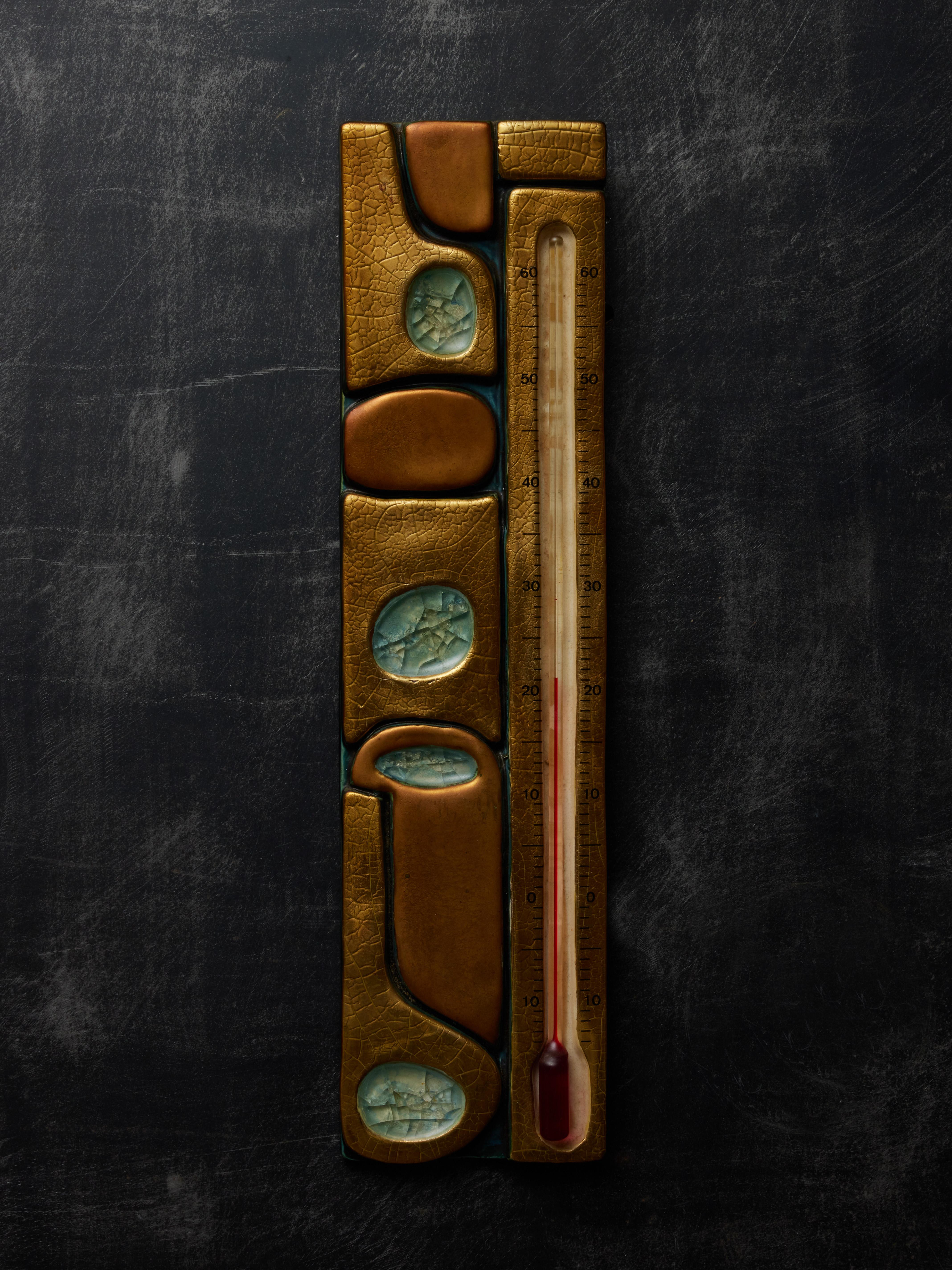 Beautiful wall thermometer in ceramic by Mithé Espelt. Abstract decors with gold glaze and pockets of molten glass

 

Marie Thérèse Espelt, aka. Mithé Espelt (1923-2020)

Born in the town of Lunel, near Montpelier; Mithé Espelt began her career in