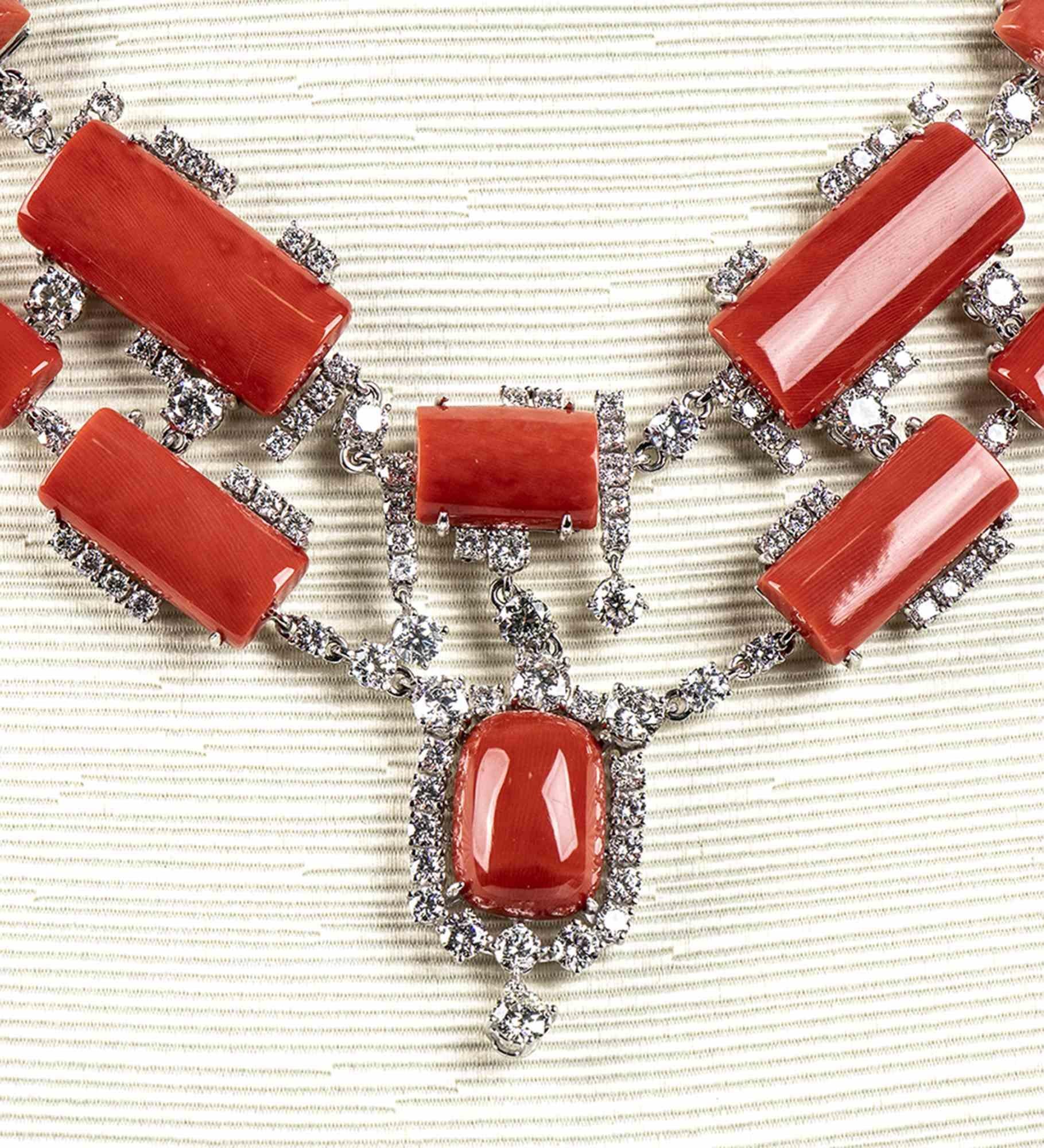 Gold, Cerasuolo coral and diamonds necklace

Necklace set with geometrical carved Cerasuolo coral beads (corallium elatius) surrounded by round brilliant cut diamonds ca. 15.68 ct, G, VS-SI.
18 white gold.
Stamped 
