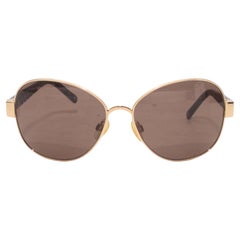 Lunettes de soleil Chanel oversize en métal doré