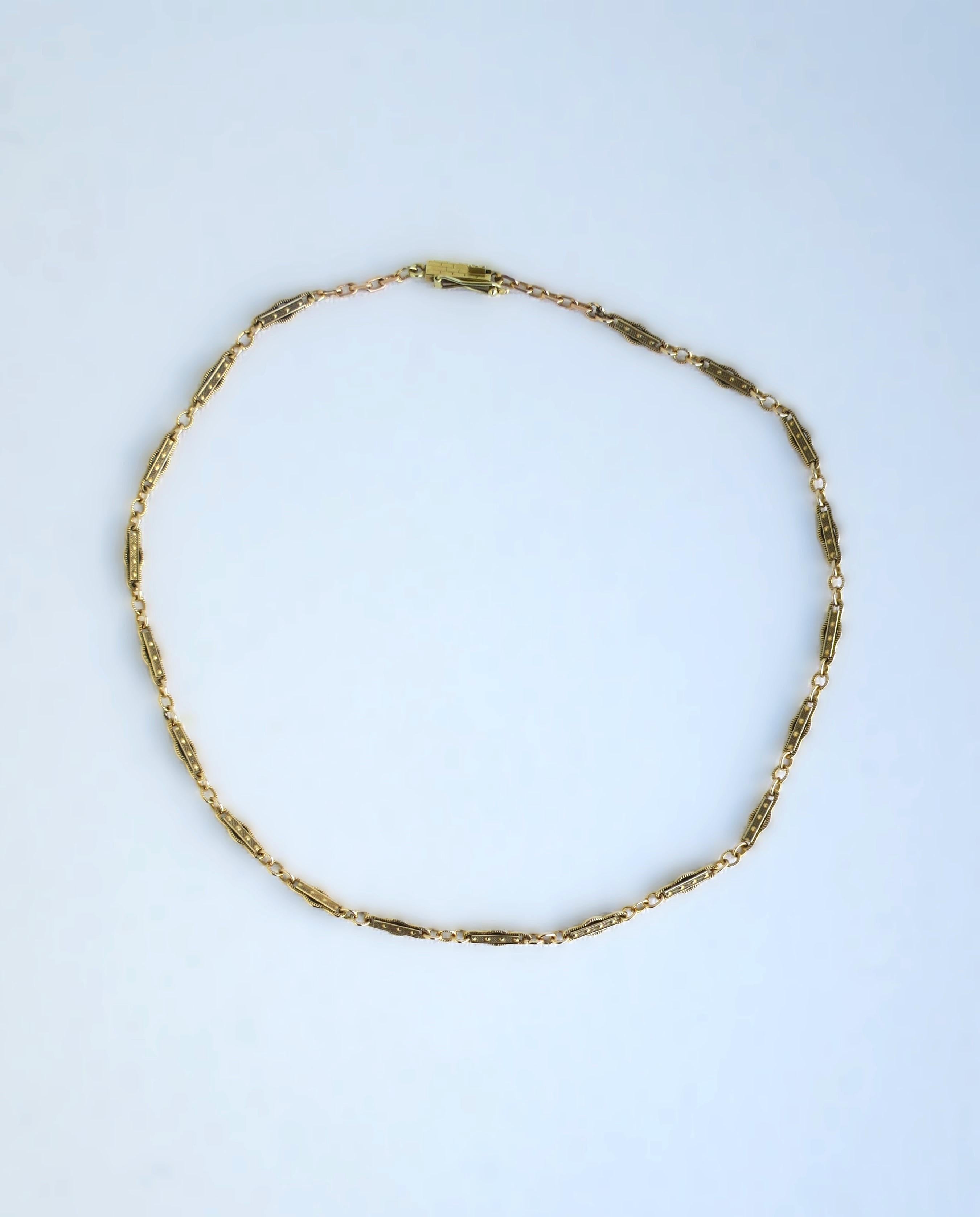 A beautiful, elegant, detailed, strong, and well-made choker necklace in 14-karat yellow gold, circa mid to late-20th century. Necklace has beautiful, detailed chain links and detailed bar clasp. A chic vintage piece to wear alone or stack with