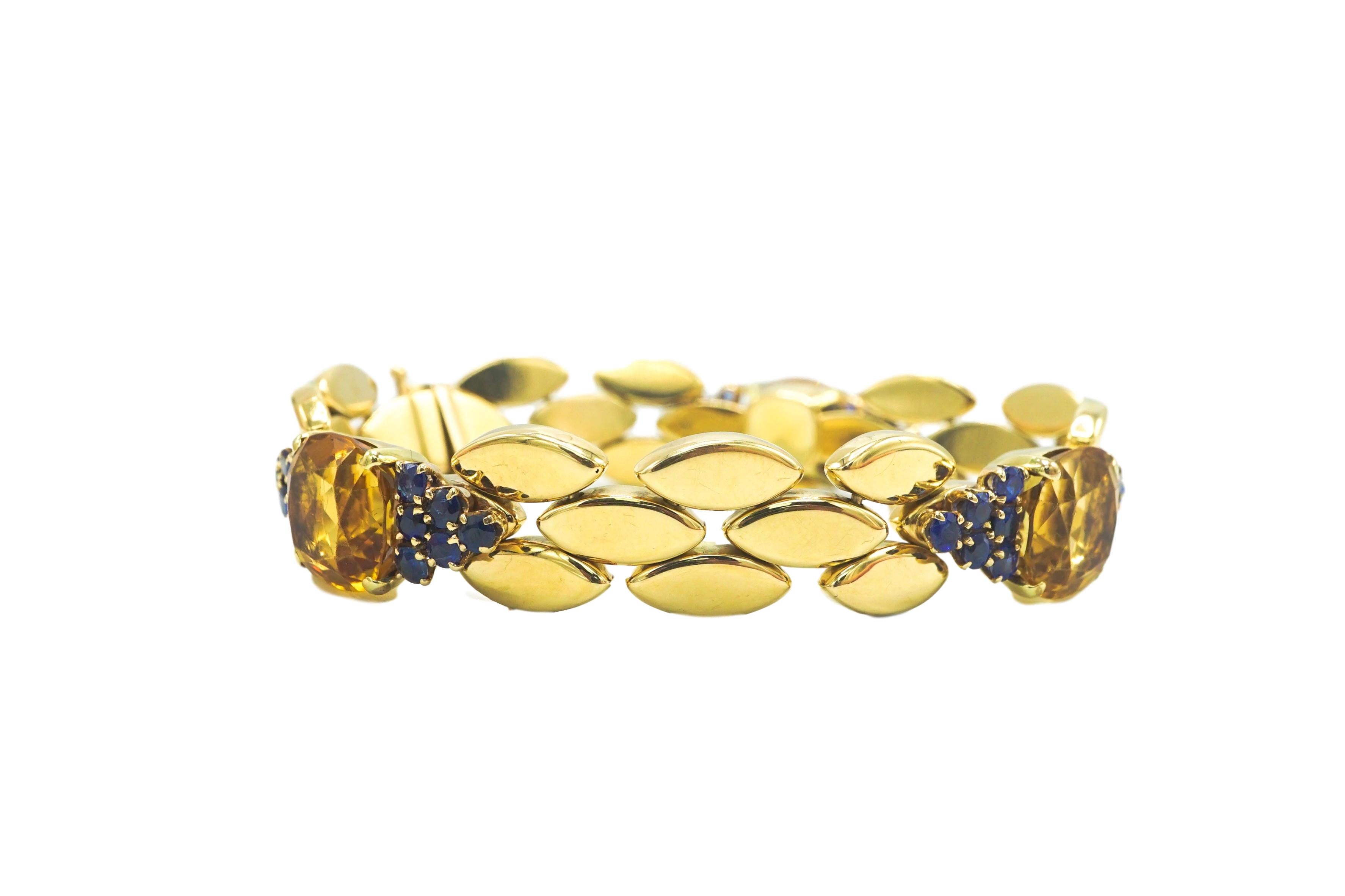 
Gold, Citrine and Sapphire Bracelet

14 kt., 3 cushion-cut citrines ap. 18.00 cts., unsigned, ap. 27.4 dwts. Length 7 9/16 inches. 

SKU#B-01538