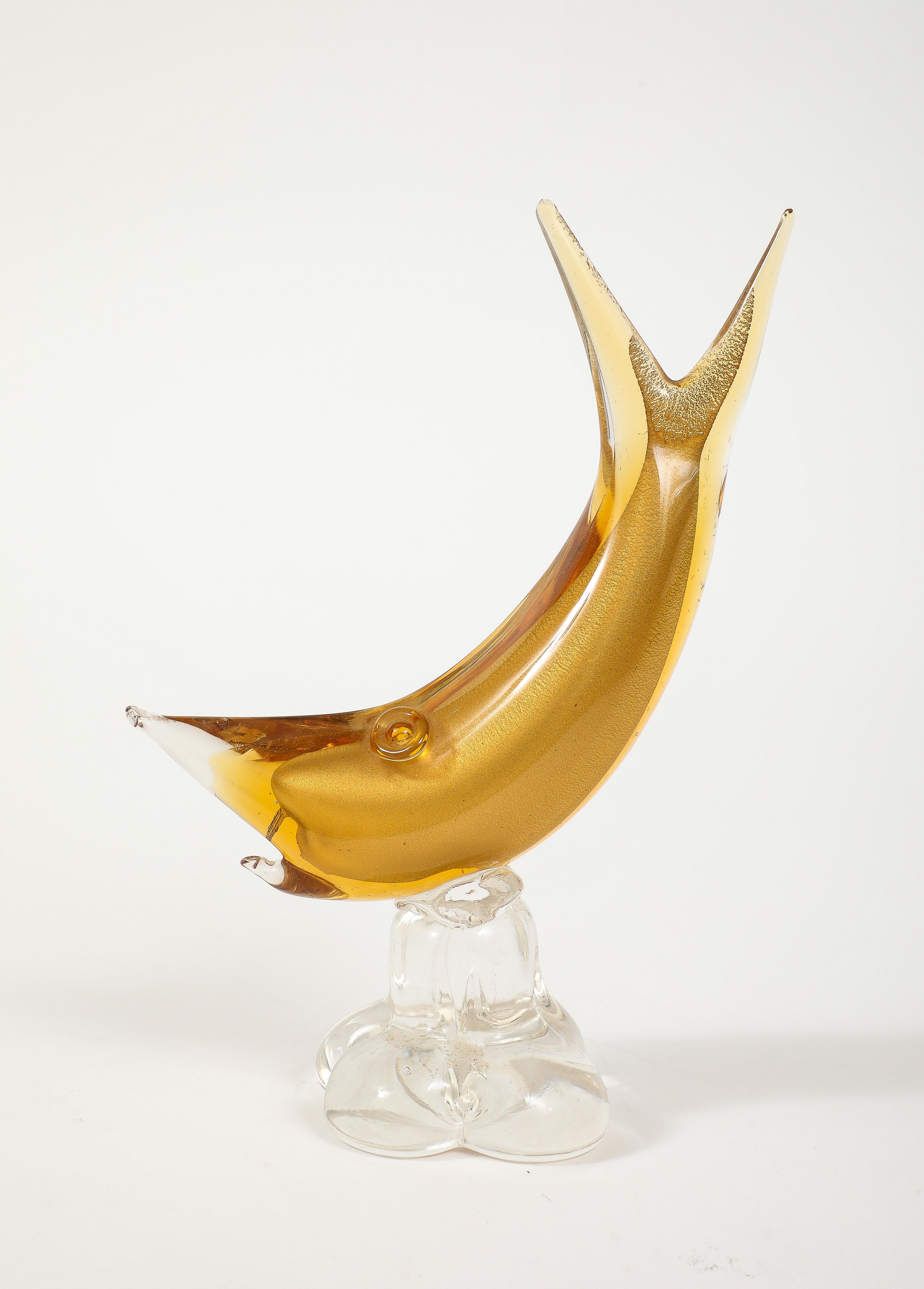 Mid Century gold Murano glass shark on clear glass stylized rock base. Barovier, Italy.