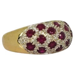 Gold cocktail ring with 32 diamonds and 17 rubies