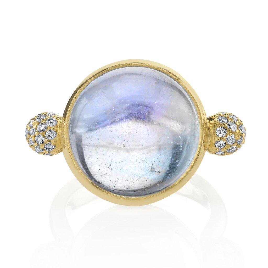This ARK Fine Jewelry statement Ring is called the Sorceress Ring because it looks like a crystal ball. It has an African Moonstone, total carat weight 11.24 and is solid 18 Karat Yellow Gold. It is detailed in white Diamond pave, total Carat weight