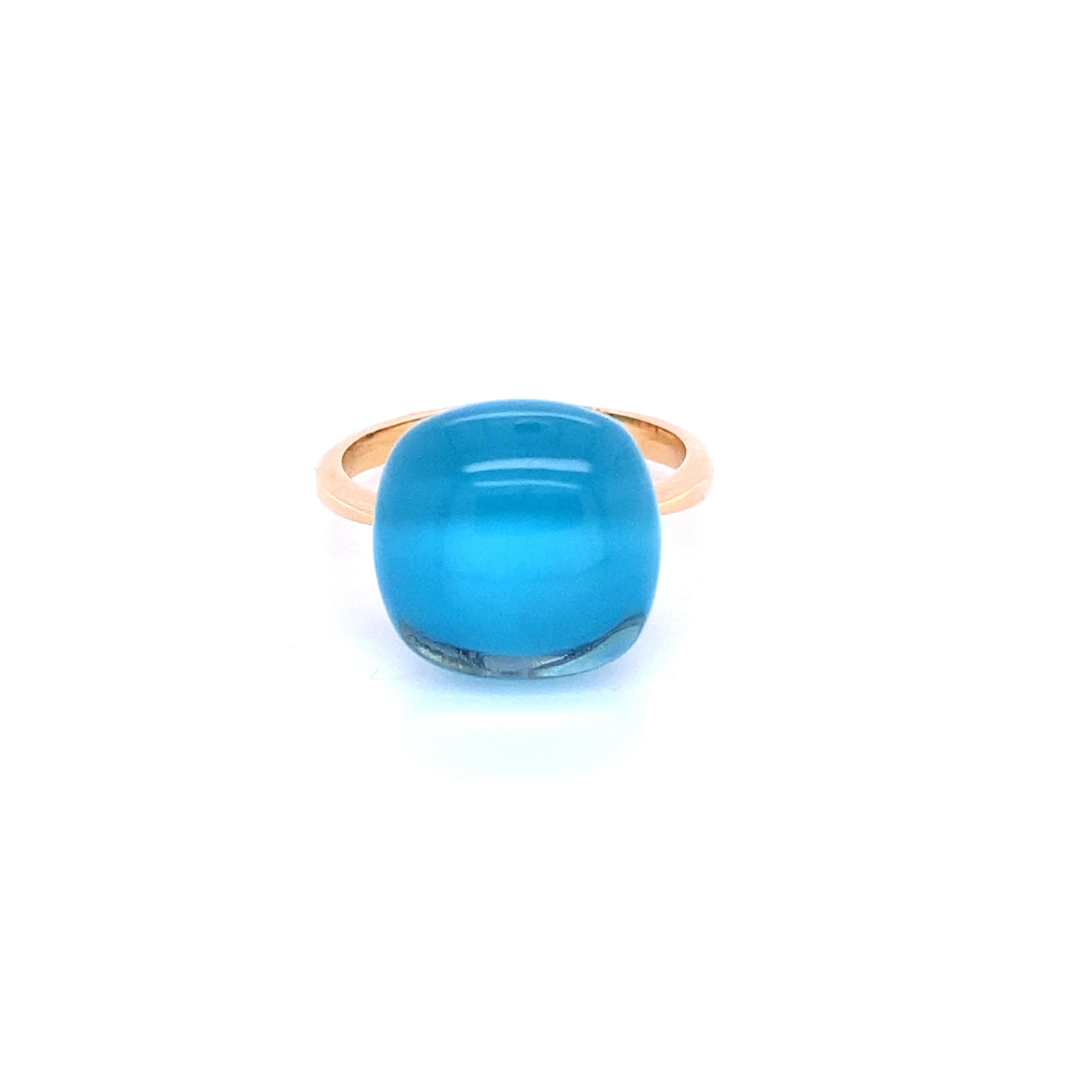 Crafted with the utmost precision and care, this cocktail ring showcases a magnificent combination of pink gold, topaz, and turquoise, resulting in an unparalleled masterpiece. The focal point of this ring is a breathtaking topaz gemstone, gracing