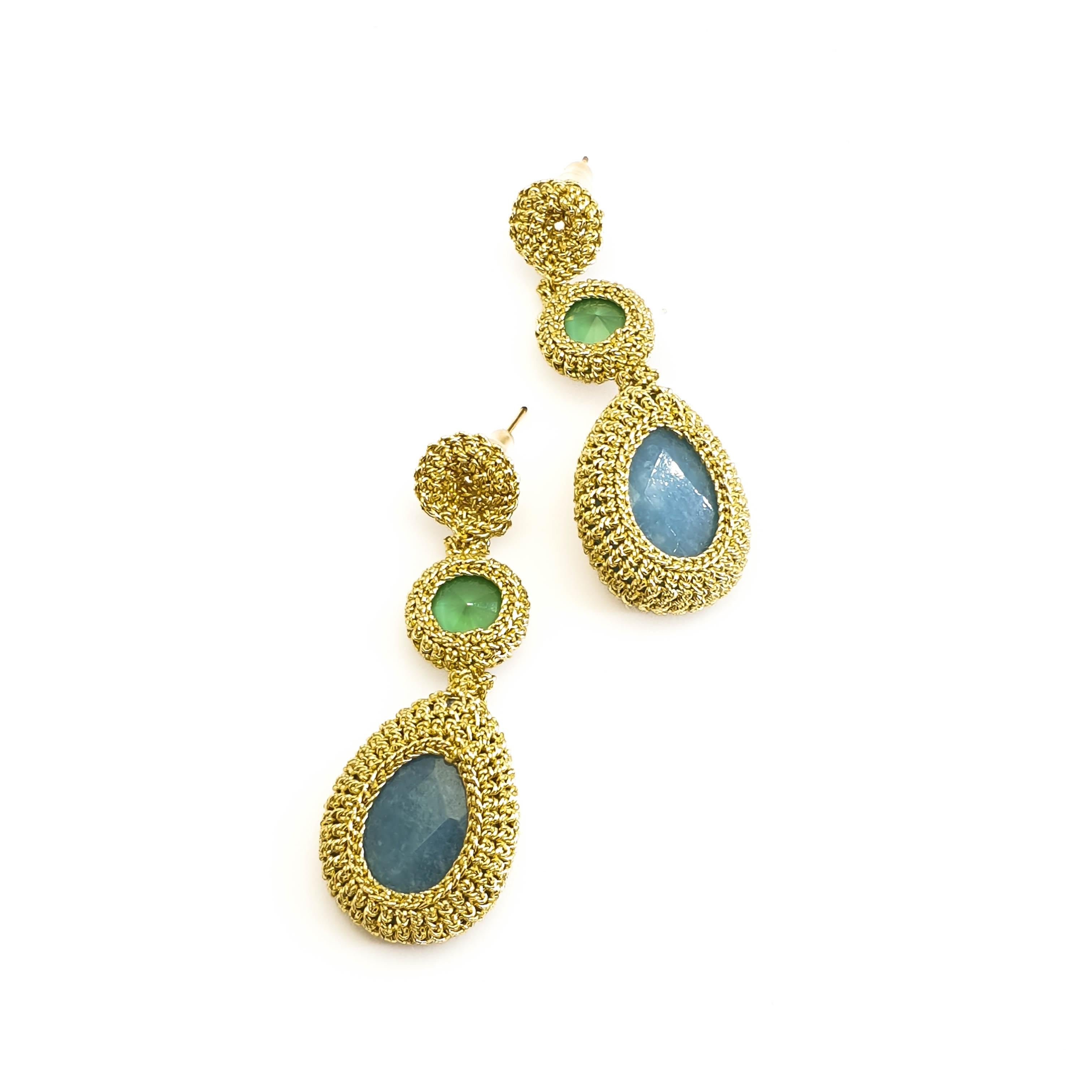 Fashionable, eye catching crochet earrings. Gold color thread tightly crochet around blue jades and vintage green Swarovski crystals.
These earrings can be custom made. Choice of stones can be altered.

The earrings are crochet with a smooth passing