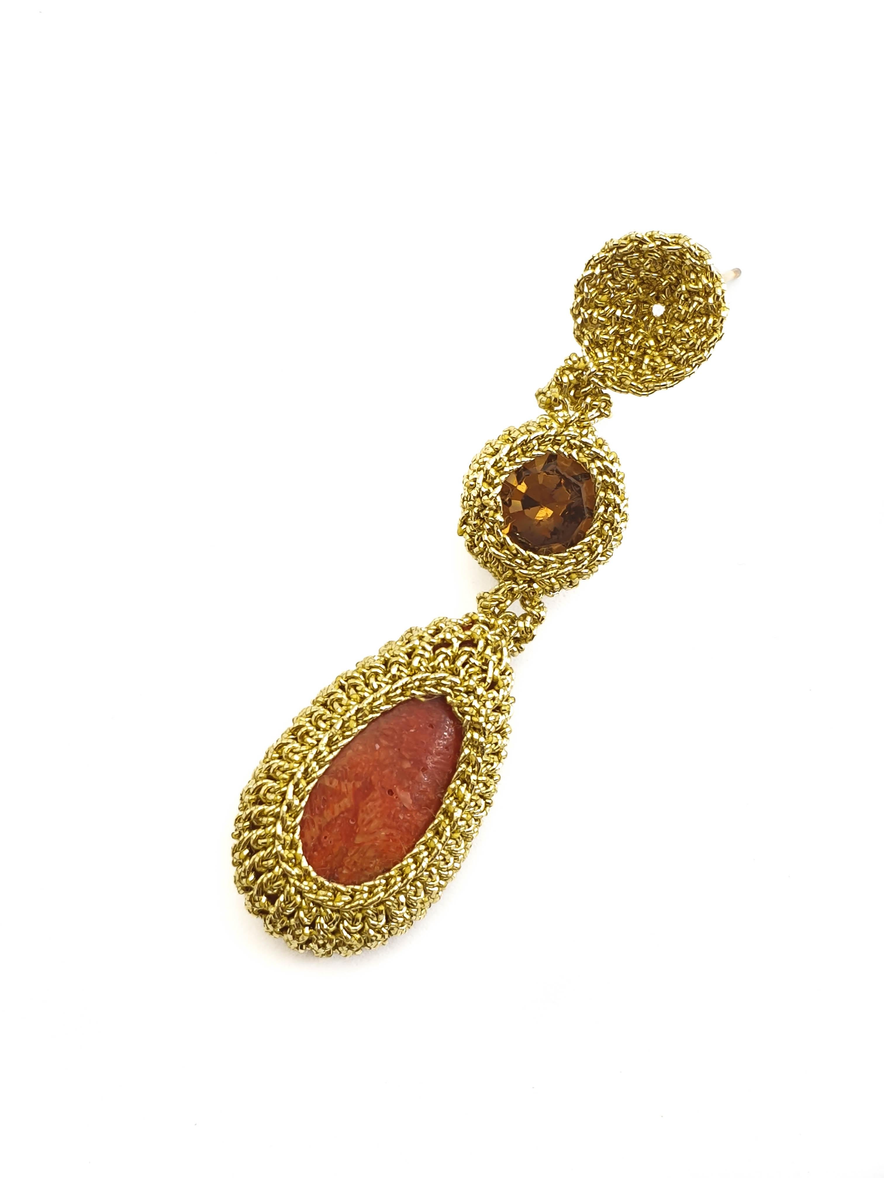Fashionable, eye catching crochet earrings. Gold color thread tightly crochet around a red corals and brown crystals. 

These earrings can be custom made. Choice of stones can be altered.

The earrings are crochet with a smooth passing thread. It is