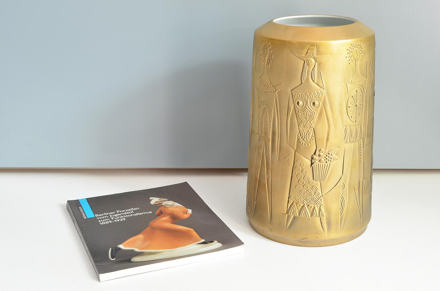 Gold colored porcelain vase designed by Cuno Fischer for Hutschenreuther, Germany, 1969. 
Vase 5141/34 - Op Art, Bisque Porcelain, relief with abstract figures.
Signed cuno fischer at the bottom and monogrammed f. 69 at the rim.