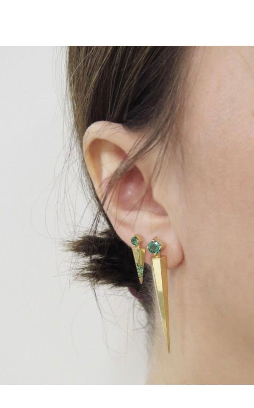 These mini Dagger Earrings are 18K yellow gold studs. Each with one prong-set round 0.25 carats Emeralds and pave Emeralds, 0.06 Carats
They are made by hand in Los Angeles, CA and the height is 3/4