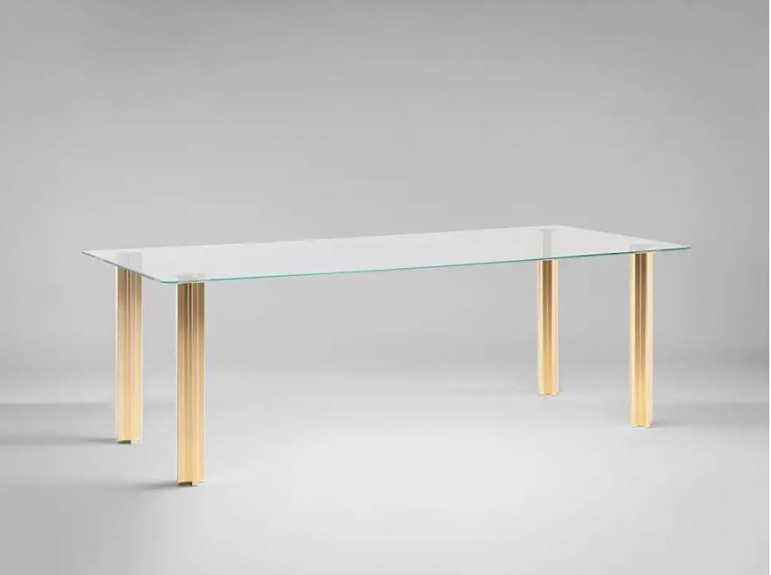 Sem Gold collection, rectangular table with glass top: extra light transparent glass or smoke grey transparent glass (12 mm thick). Plated aluminium legs finished in 24-karat polished or fine brushed yellow gold. The Gold collection has a range of