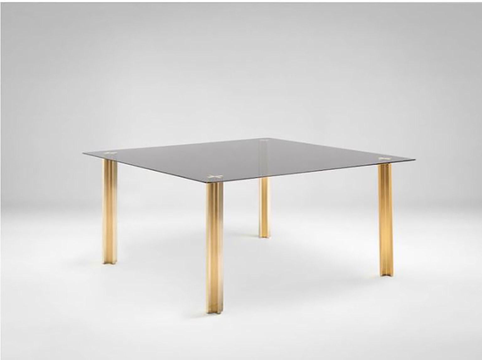 SEM Gold collection, square table with glass top: extra light transparent glass or smoke grey transparent glass (12 mm thick). Plated aluminium legs finished in 24-karat polished or fine brushed yellow gold. The Gold collection has a range of