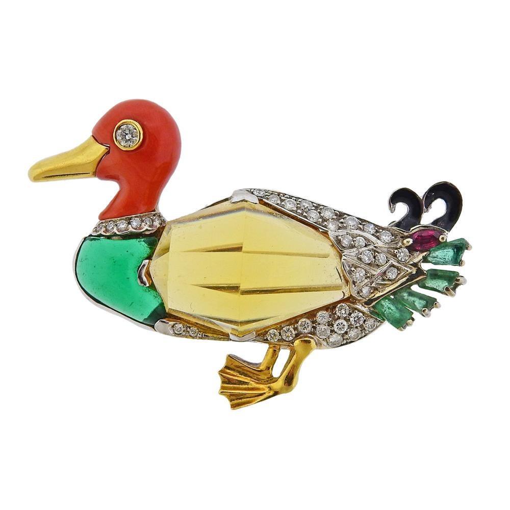 Adorable 18k white and yellow gold duck brooch, featuring one large faceted citrine, coral, emeralds, onyx, ruby and approx. 0.40ctw in diamonds. Brooch measures 48mm x 35mm. Marked 70 and with Italian mark.  Weight - 14.3 grams.