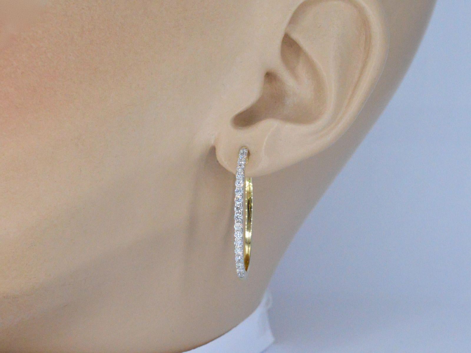 Yellow gold creole earrings with brilliant cut diamonds are a stunning piece of jewelry that feature a classic hoop design made from warm yellow gold. The diamonds used in these earrings are expertly cut to maximize their brilliance and sparkle,