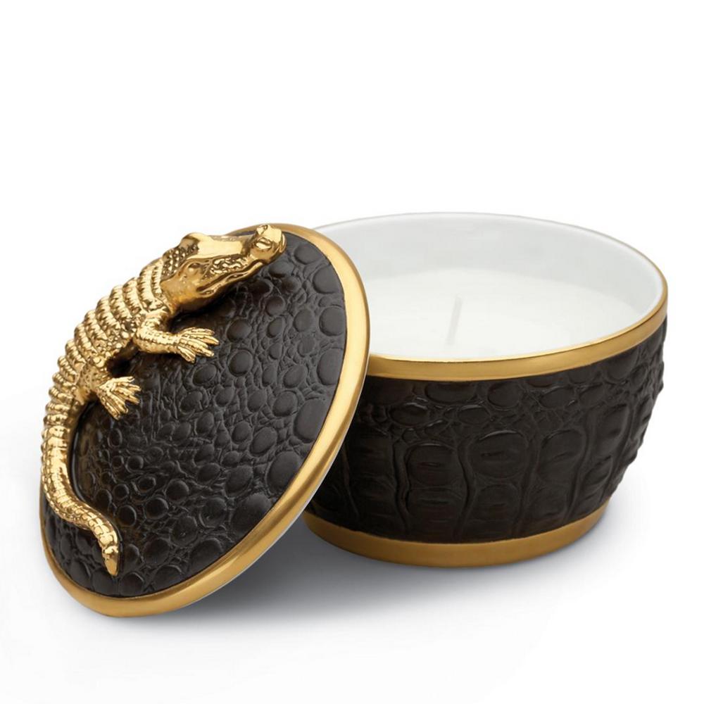 Candle box Gold Croco made with white porcelain
from Limoges, France. With porcelain lid. With gold
plated 24 karat crocodile and with black crocodile 
skin in leather style. Inside with paraffin wax with single
wick, fragrance champagne pink.