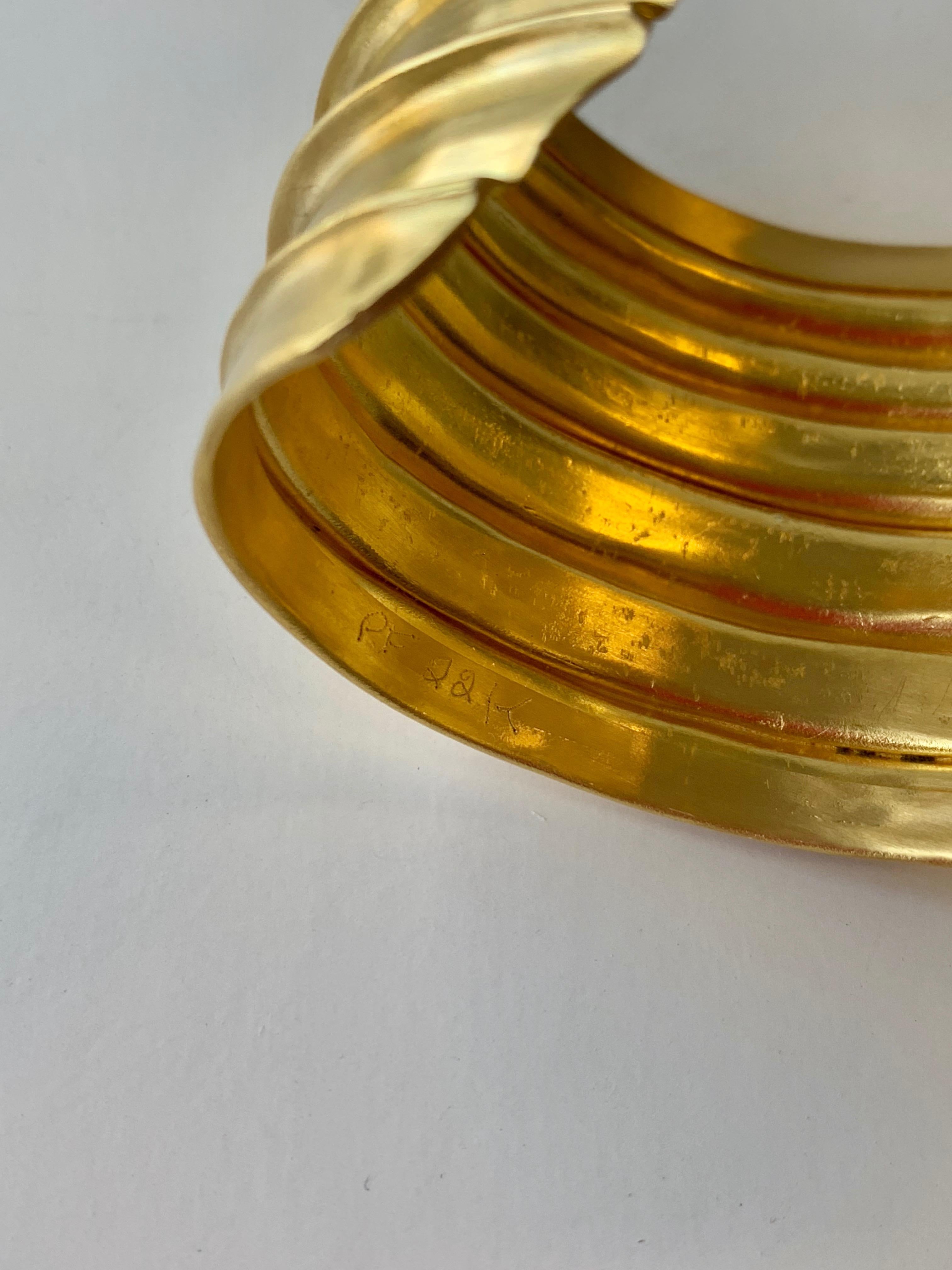 Inspired by the gold cuffs of ancient Greeks and Egyptians, this fold formed cuff would be a timeless addition to any jewelry collection. Hand formed, 22 karat gold. Two inches wide.  Made in New York. 