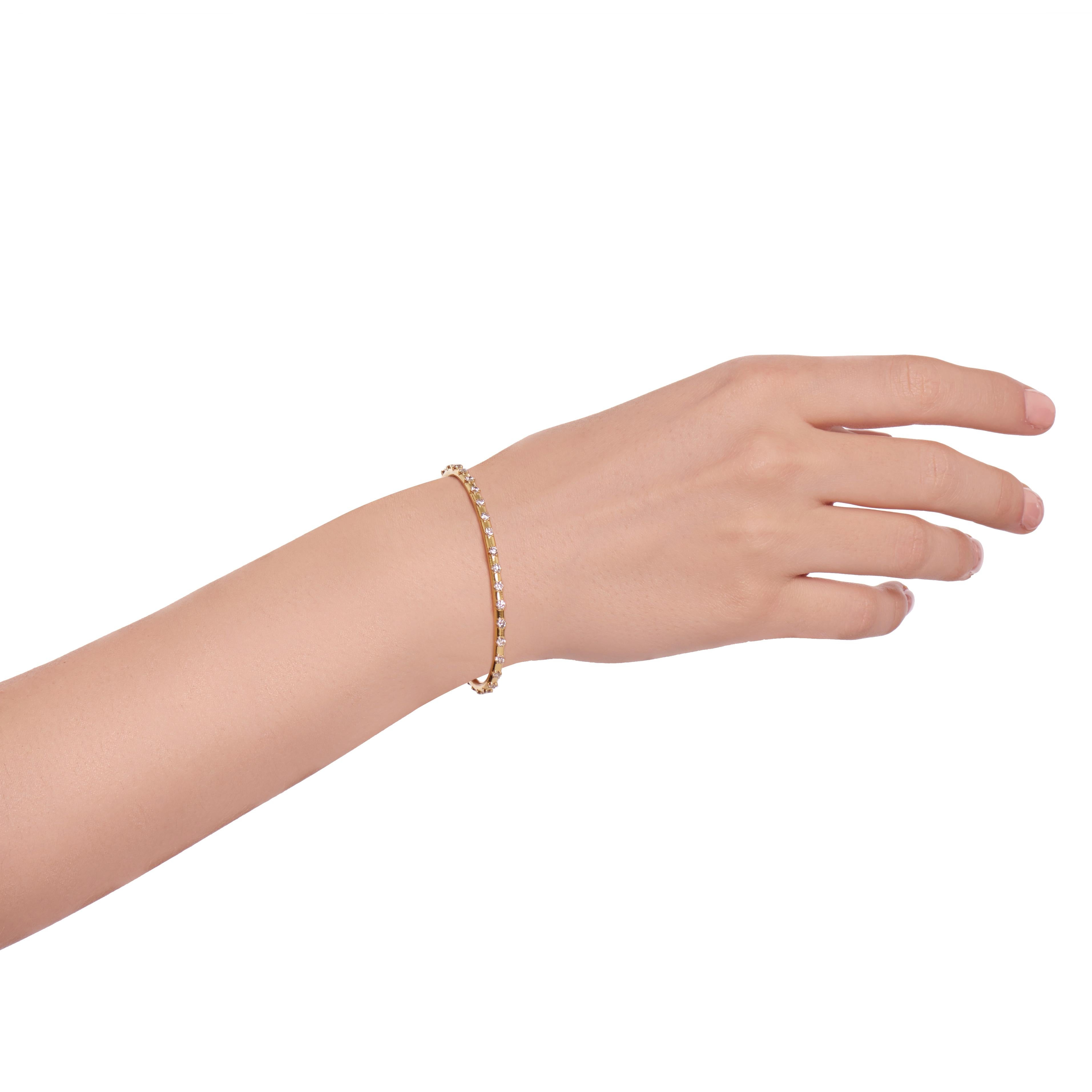 A solid 18 Karat Yellow Gold with 30 White Diamonds, total Carat weight 1.60.
This Cuff is called the 'Intention Cuff' and is designed to remind you to keep your attention on your intentions. 
It has a 2 cm opening and is 6