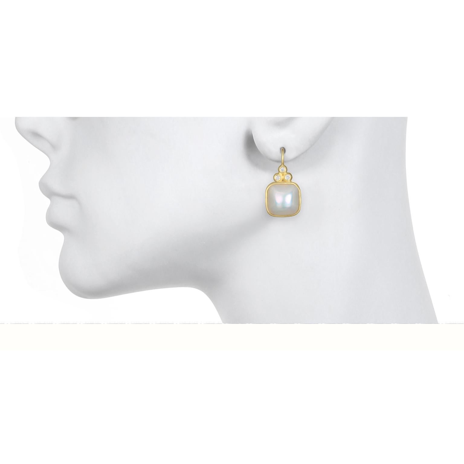 A classic combination of diamonds and pearls. Faye Kim's mabe pearl earrings with triple diamonds are bezel set in 18k gold with lever backs. AAA Gem quality mabe pearls have a beautiful luster and the very desirable rose overtones. 
Length x Width: