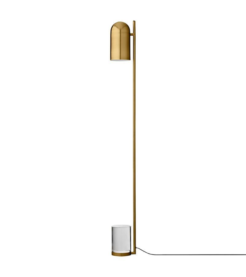 Gold cylinder floor lamp
Dimensions: Diameter 12 x H 140 cm 
Materials: Glass, Iron w. Brass Plating & Powder Coating.
Details: For all lamps, the recommended light source is E27 max 25W&220/240 voltage. We recommend LED in order to avoid