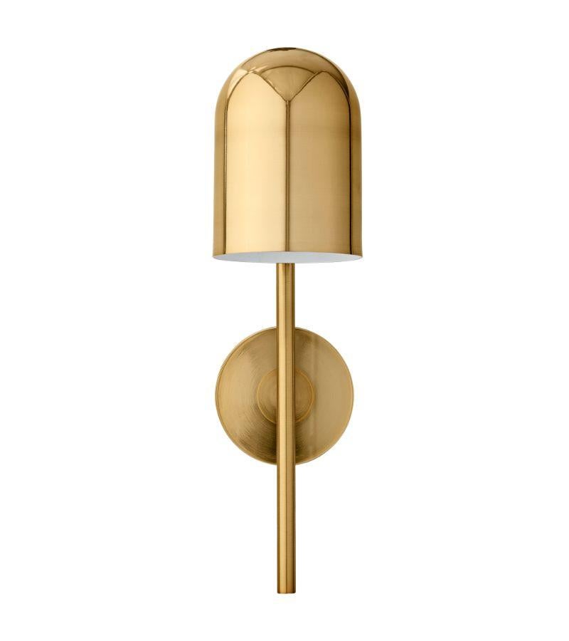 Gold cylinder wall lamp
Dimensions: Diameter 12 x height 45 cm 
Materials: Glass, iron w. Brass plating & powder coating.
Details: For all lamps, the recommended light source is E27 max 25W&220/240 voltage. We recommend LED in order to avoid